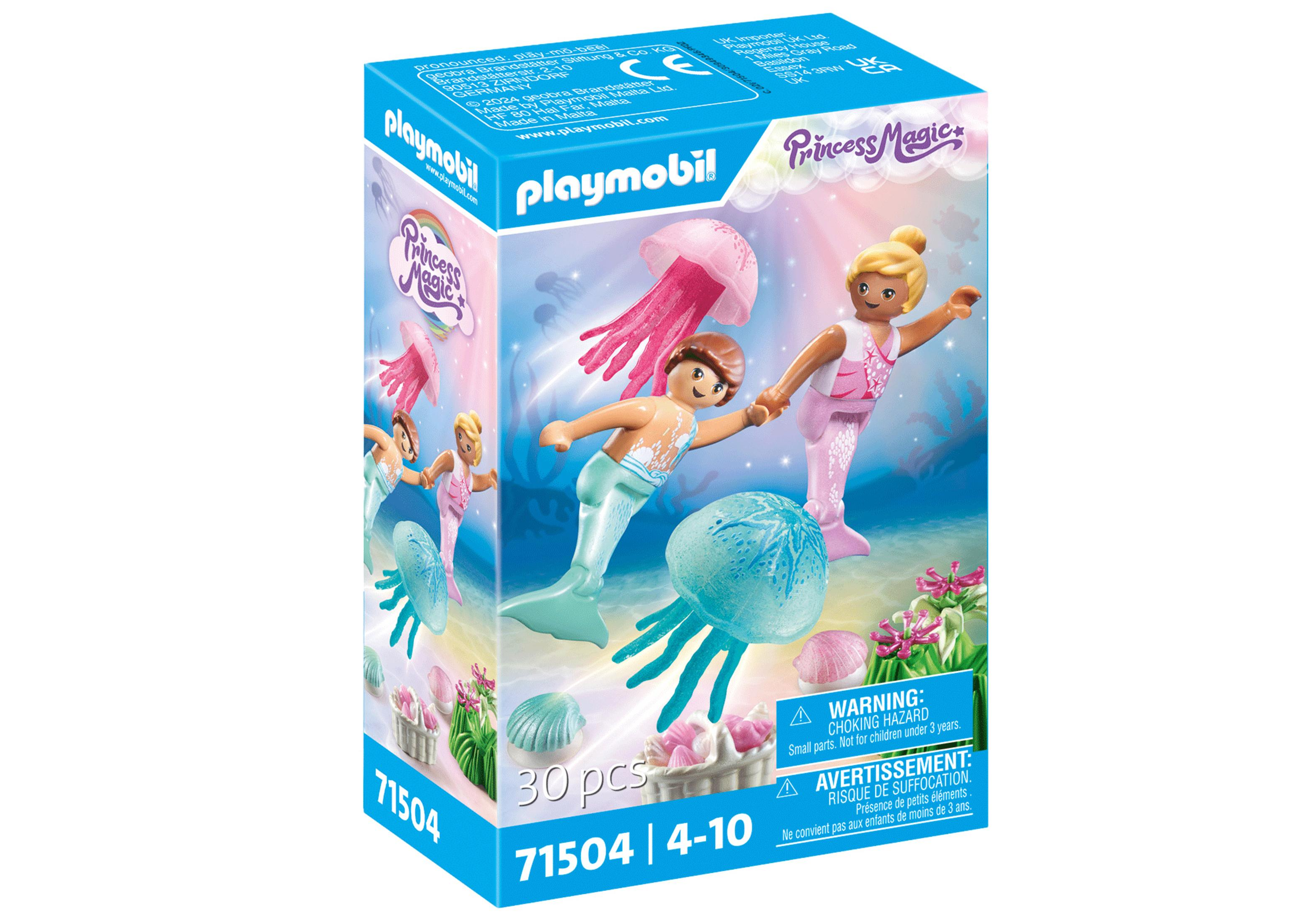 Playmobil-Box mit Meerjungfrau-Figuren und Meereskreaturen. Rosa und Blau dominieren die Szene.
