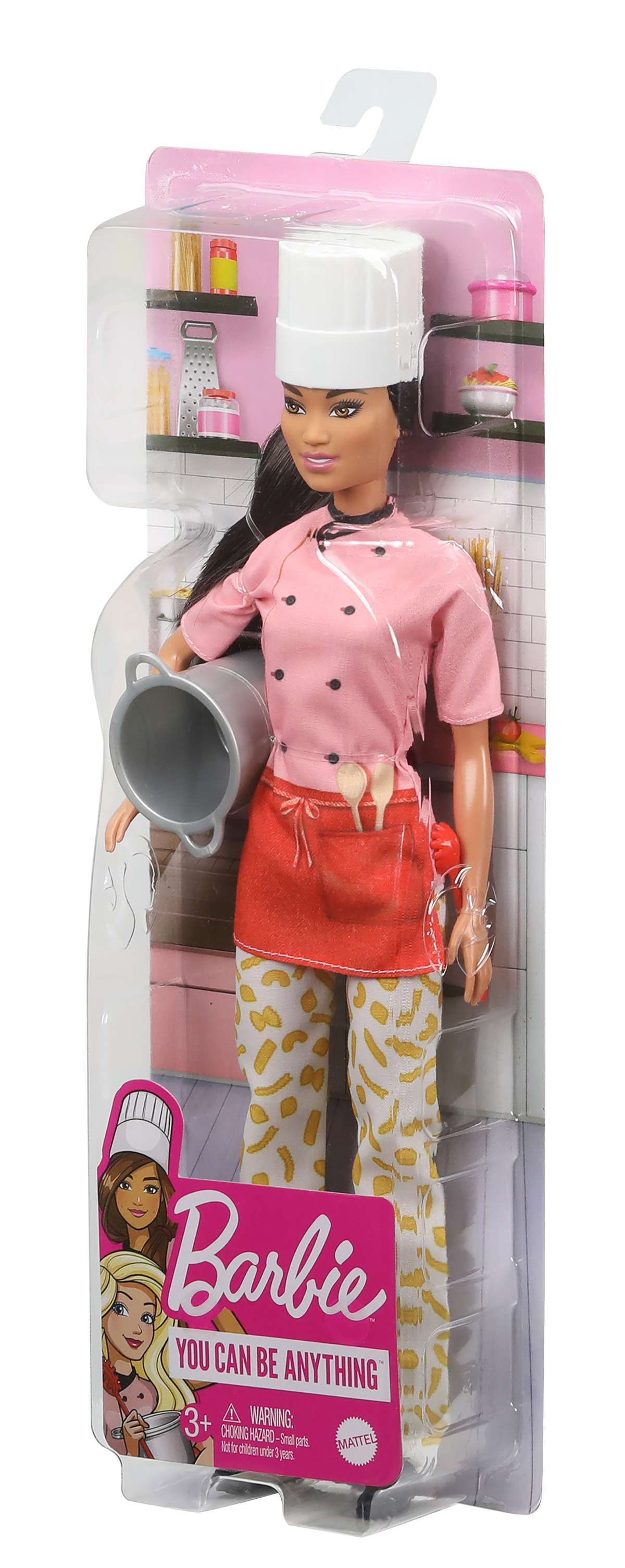 Lalka Barbie w stroju szefowej kuchni w opakowaniu, z tłem kuchni.