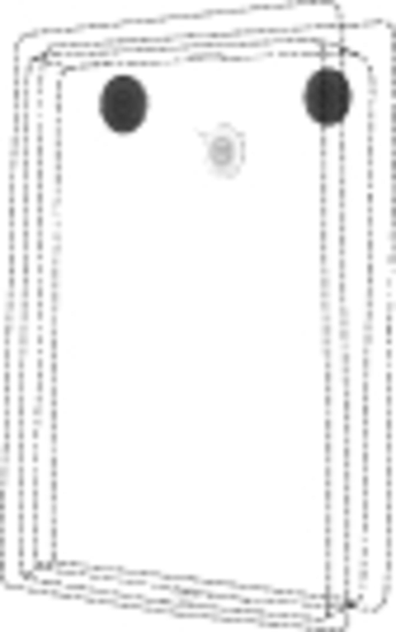 Rozmyty obraz białego prostokąta z dwoma ciemnymi okręgami u góry.