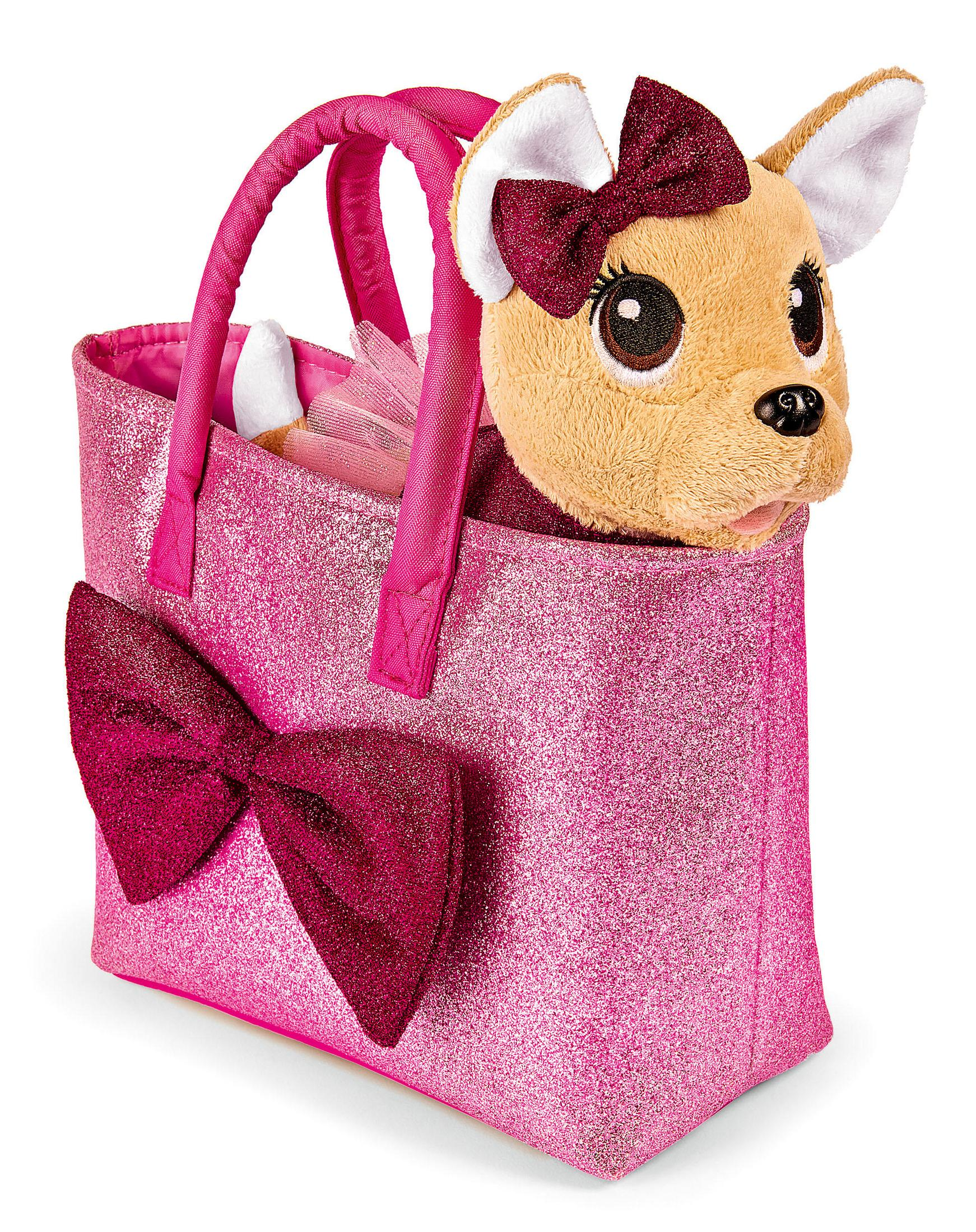 Eine rosa glitzernde Tasche mit einem Spielzeug-Welpenkopf, der herausragt. Eine große rosa Schleife ist an der Tasche.
