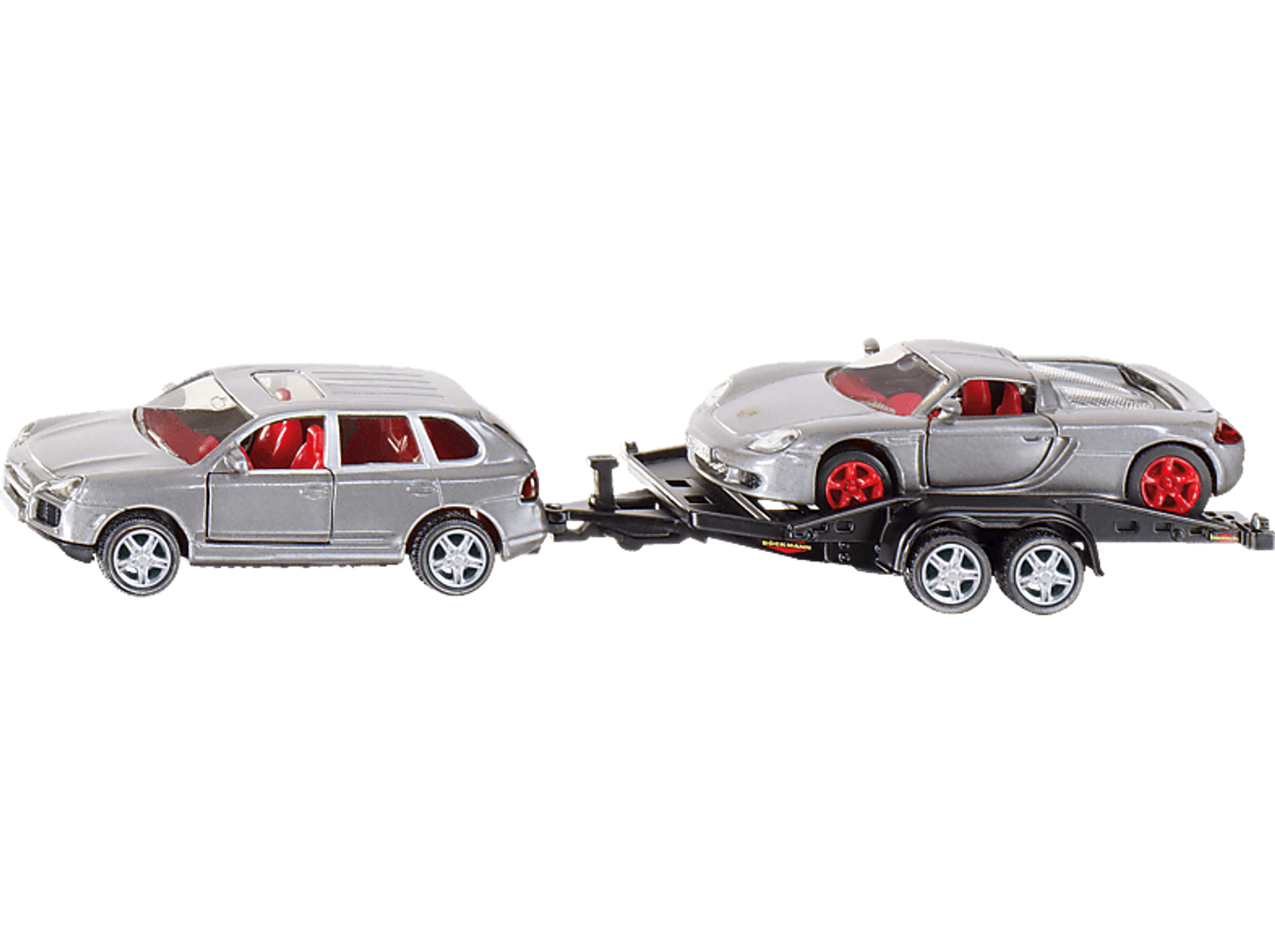 Zabawkowy transporter samochodowy z dwoma samochodami na czarnym tle.