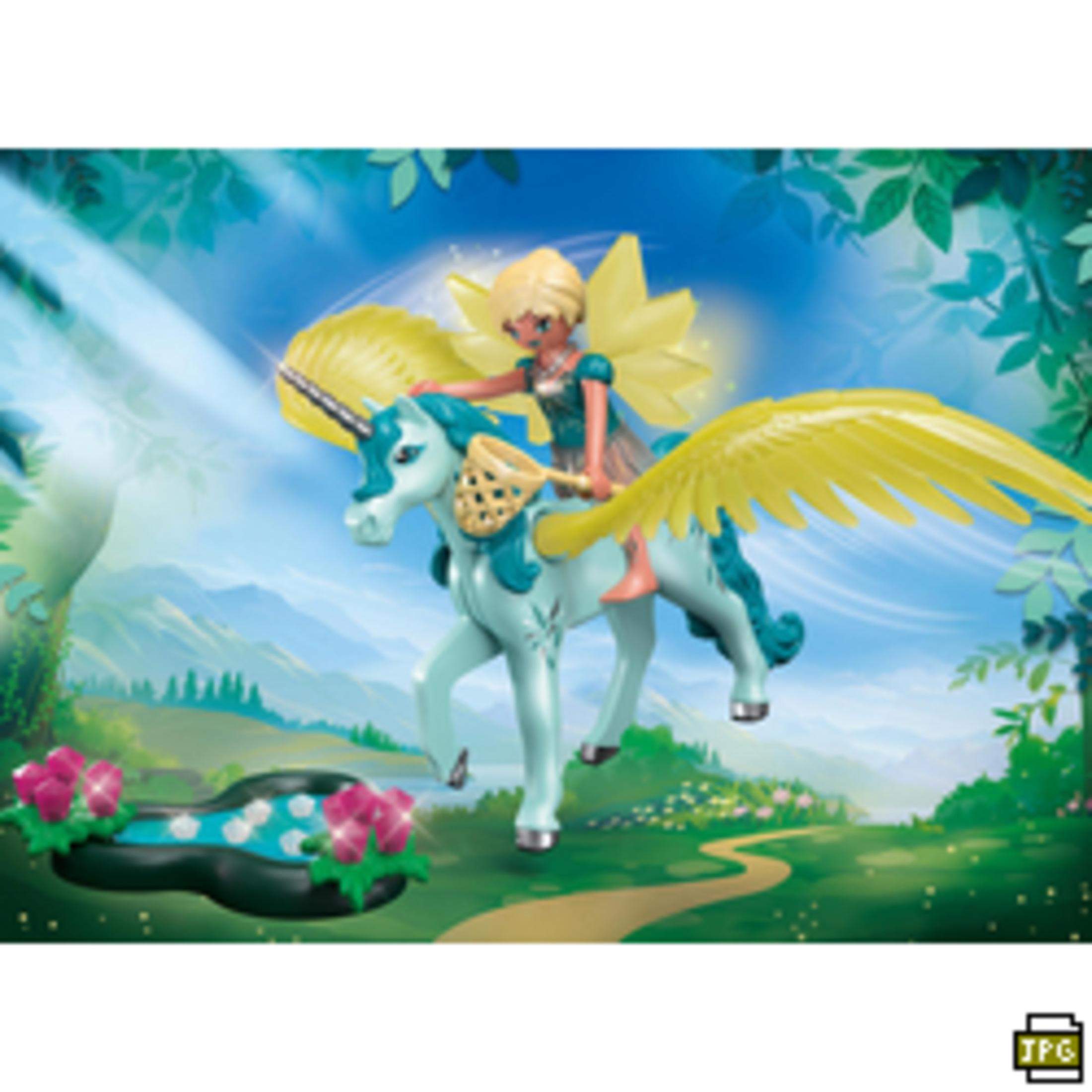 Scena zabawek fantasy: dziewczyna jadąca na jednorożcu ze skrzydłami. Zielone i niebieskie tło.