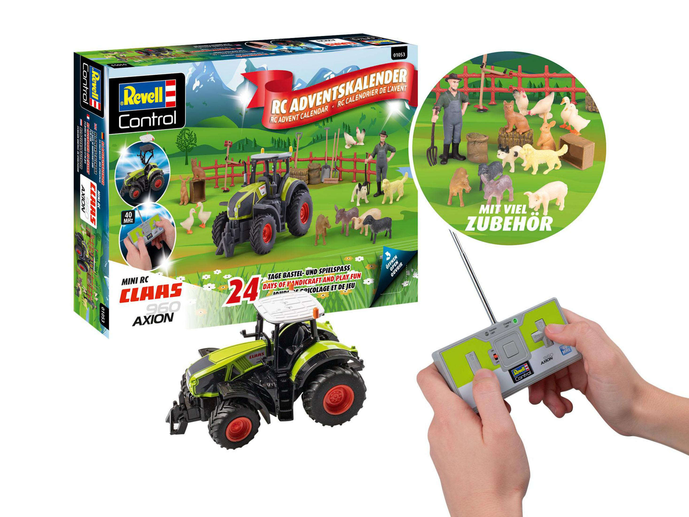 Un tractor de juguete y una caja con animales de granja y un mando a distancia.