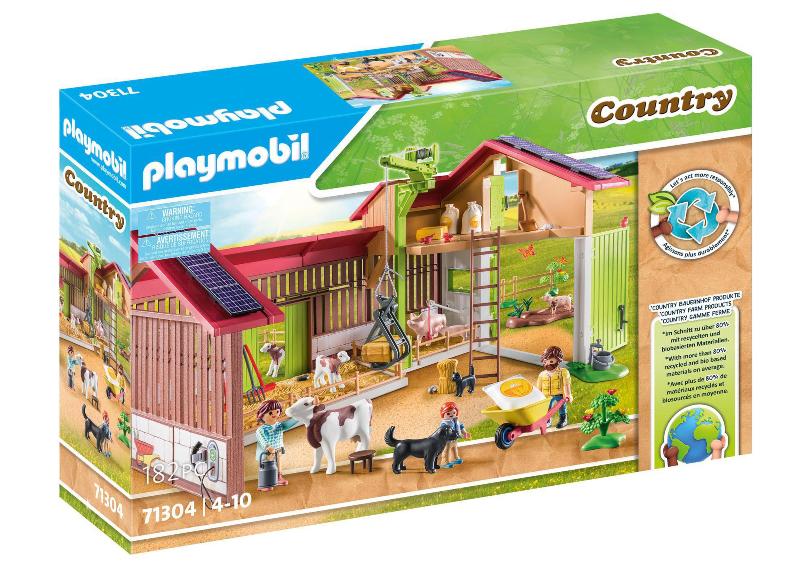 Ein Playmobil Country Bauernhof-Set mit Gebäuden, Figuren, Tieren und einer Box.