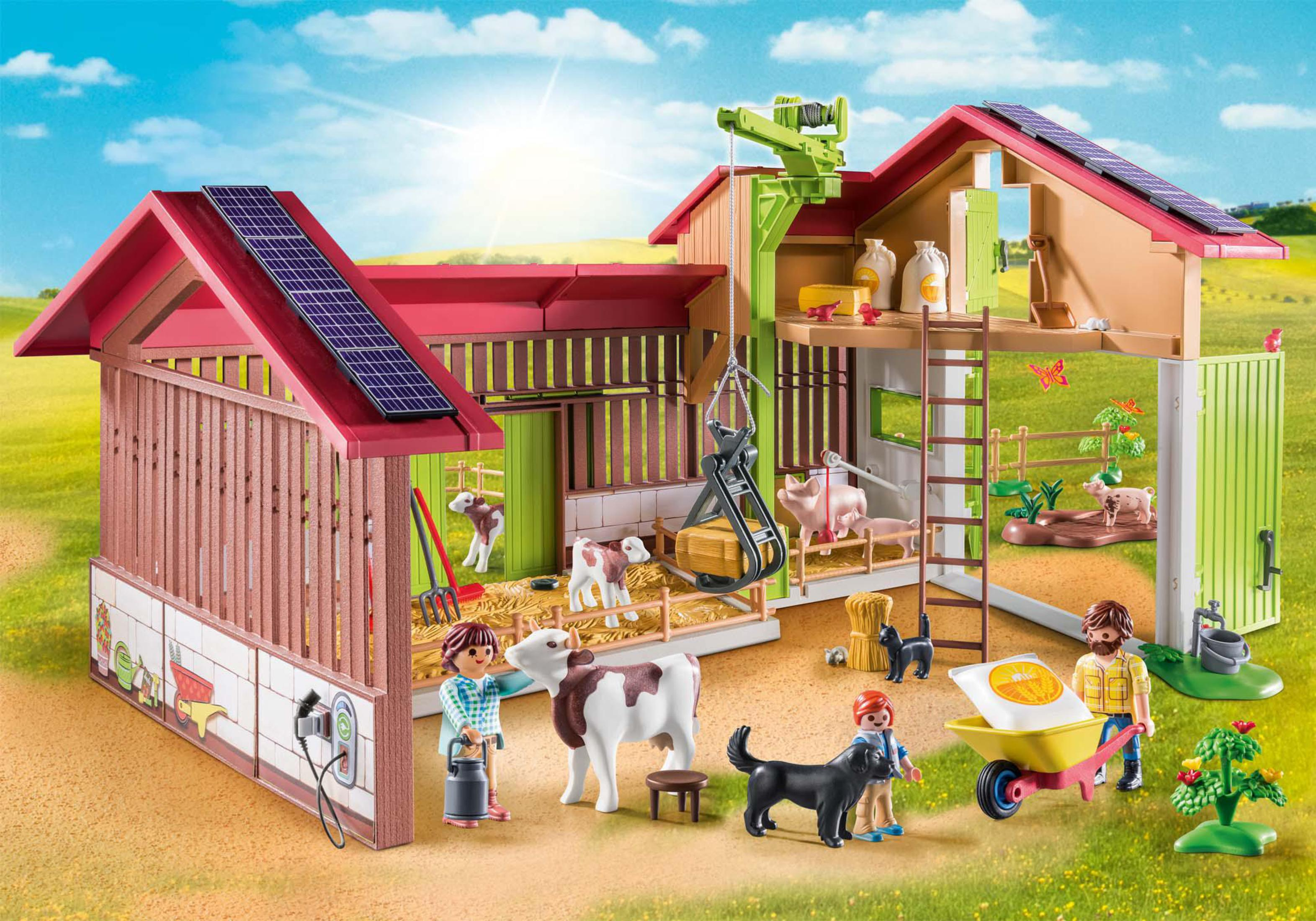 Ein Bauernhof-Spielset mit Scheune, Kühen, Schweinen, Menschen und einem Traktor.