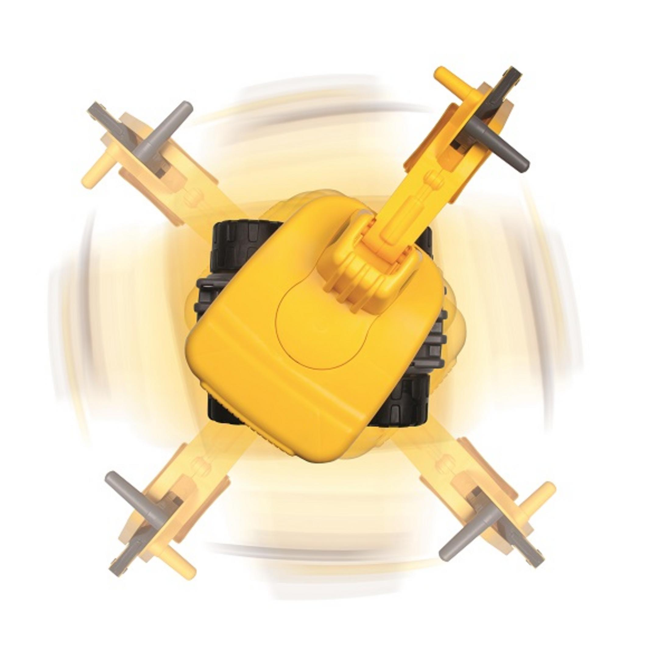 Widok z góry na żółtą zabawkę z czterema szarymi ramionami, zabawka wydaje się obracać.