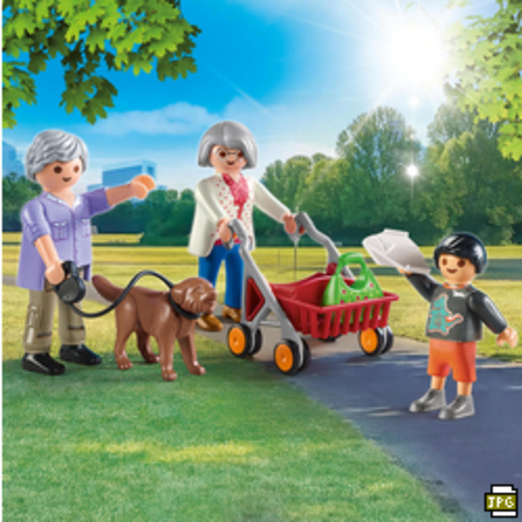 Figurki Playmobil: dwie kobiety z psem i dziecko w parku.