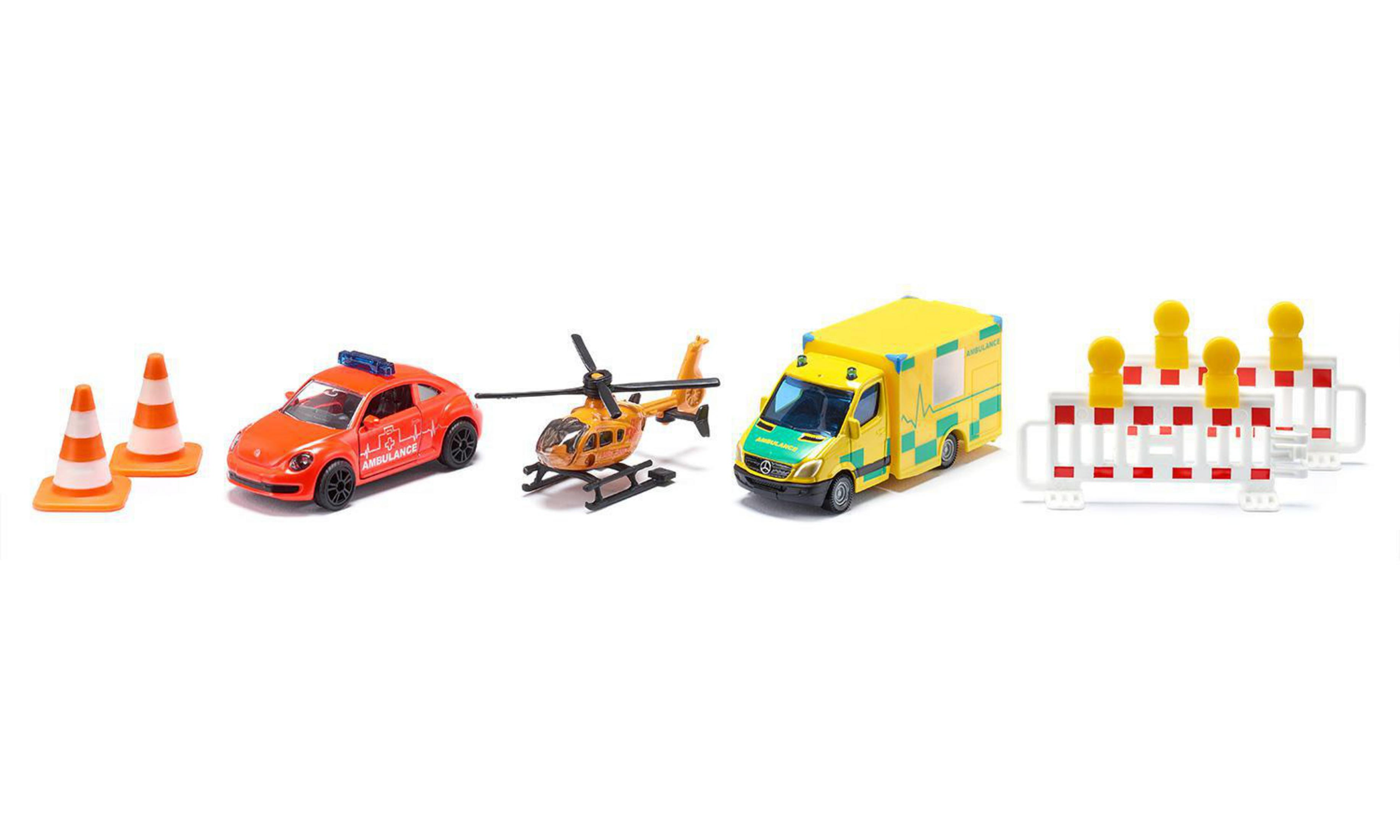 Spielzeug-Notfallfahrzeuge, darunter ein Auto, ein Hubschrauber und ein Krankenwagen, auf weißer Oberfläche.