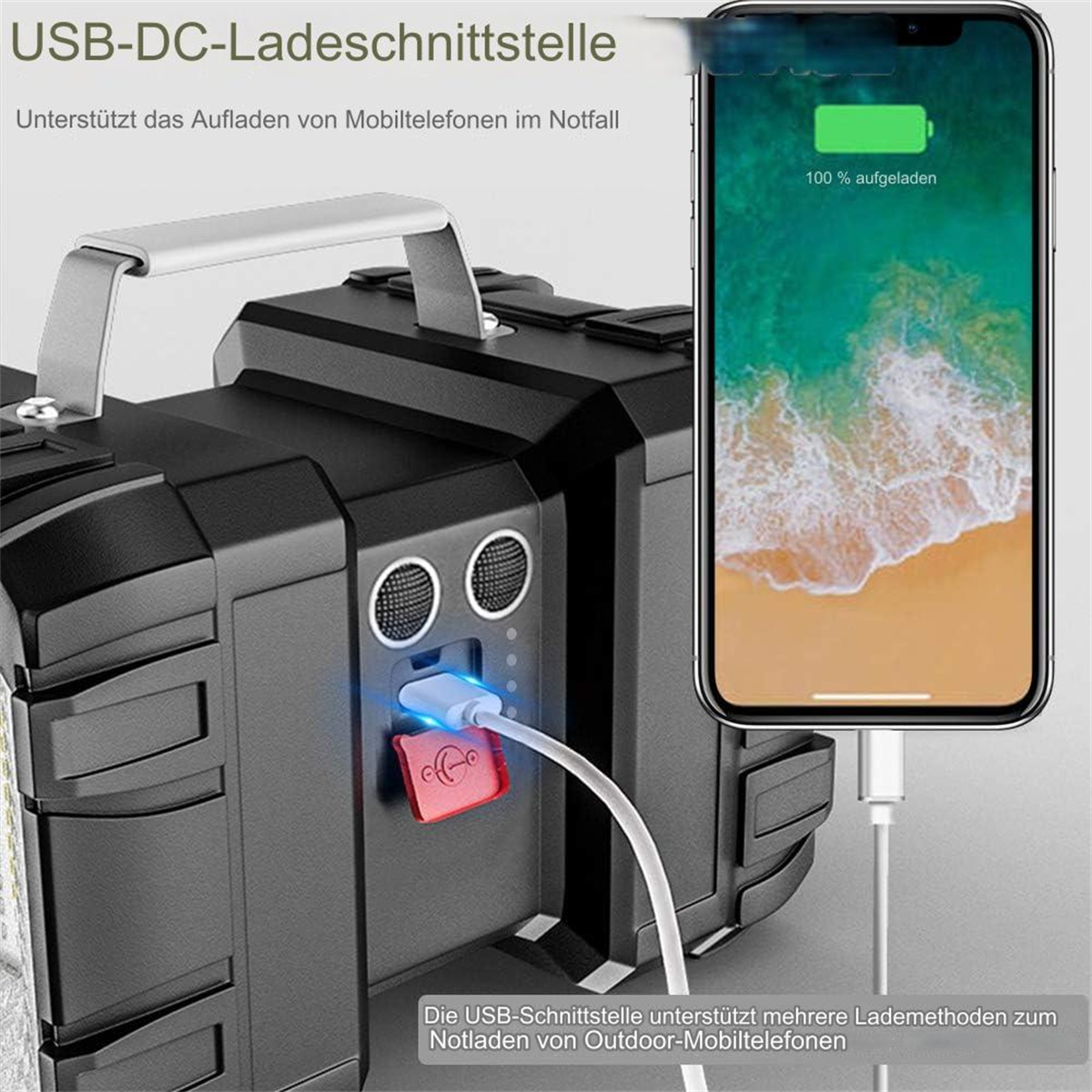 Schwarze tragbare Powerstation lädt ein Telefon über USB auf. Das Telefon zeigt 100 % Ladung. Weißer Hintergrund.
