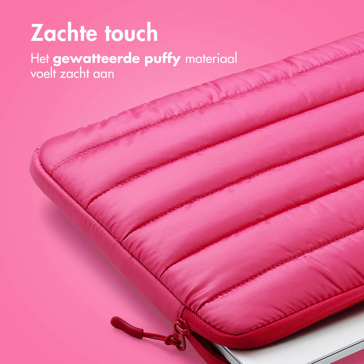 Close-up of a pink, quilted laptop sleeve. Text reads: "Soft touch. The padded material feels soft."