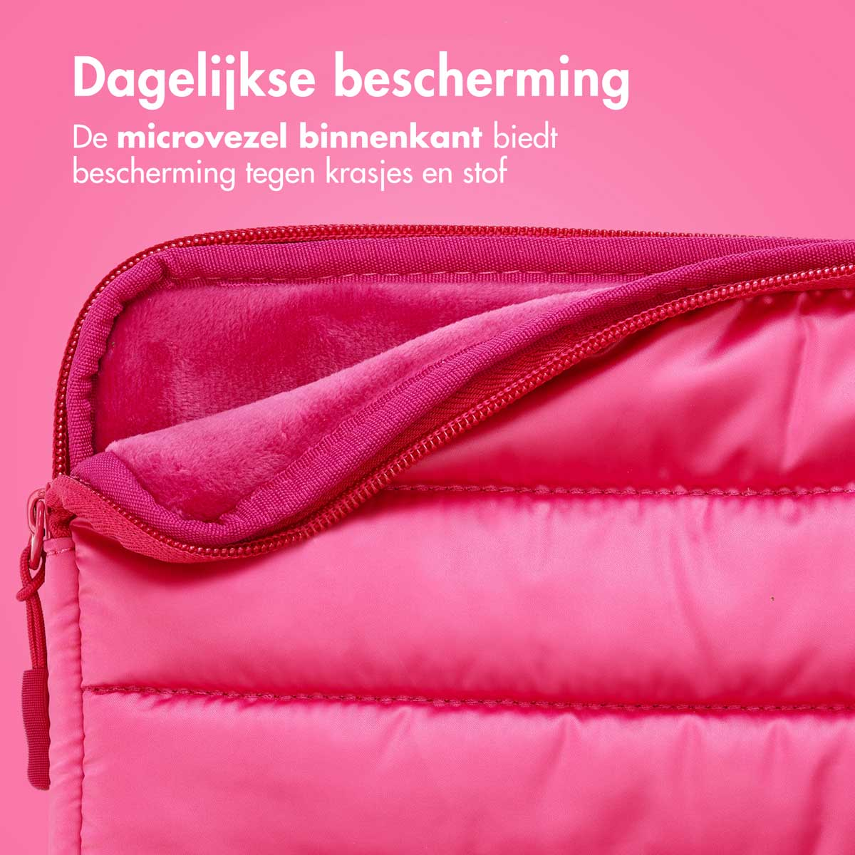 Close-up of a pink laptop sleeve interior with a soft microfiber interior and zipper closure.
