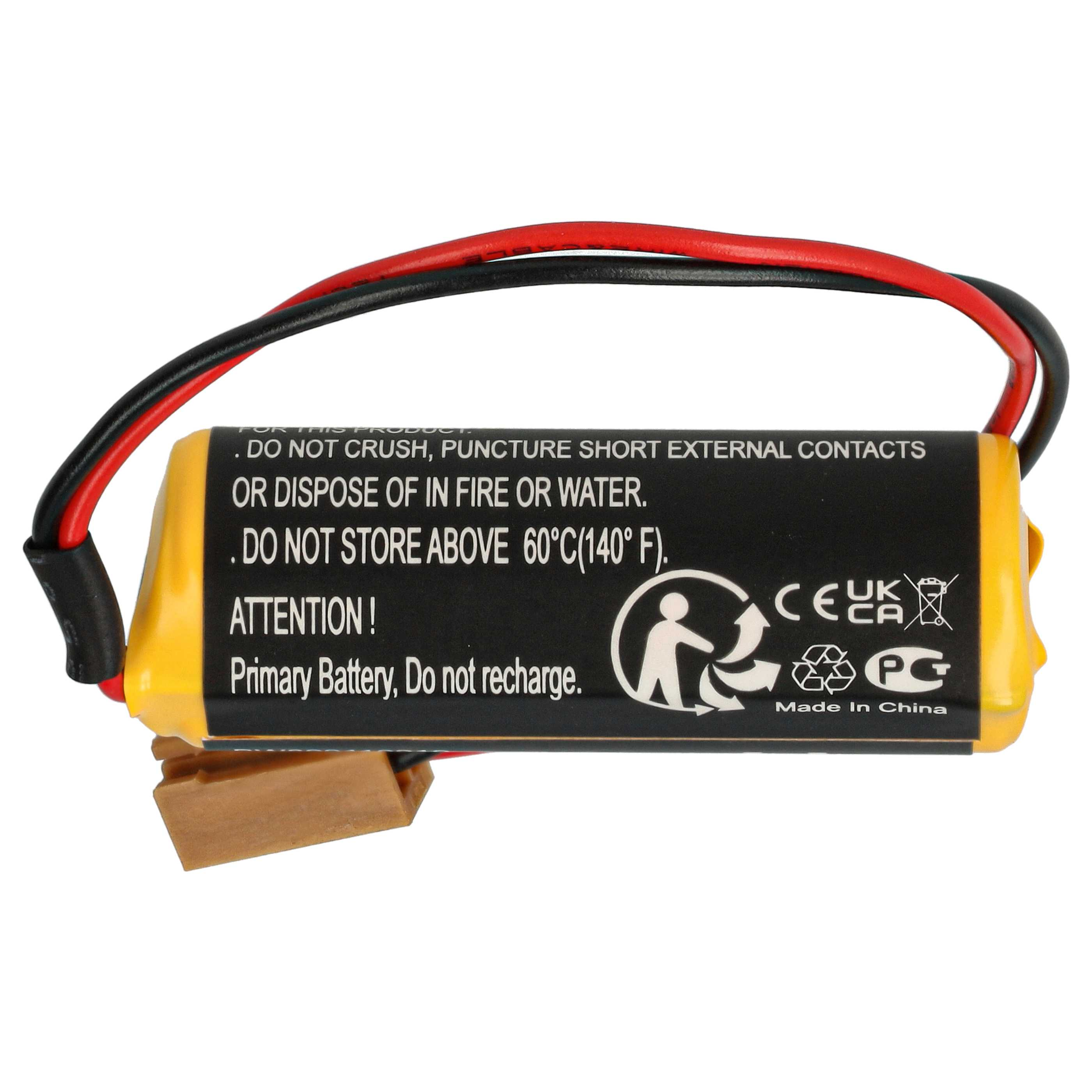 Gelbe Primärbatterie mit schwarzen und roten Drähten und einem braunen Stecker. Text auf der Batterie.