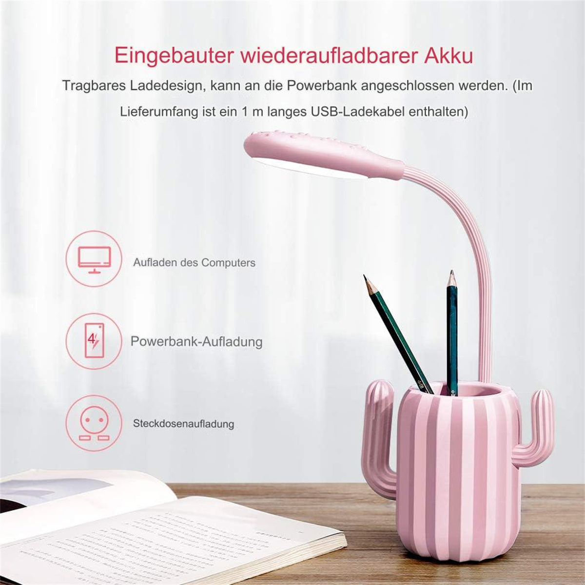 Eine rosa Schreibtischlampe mit einem kakteenförmigen Stifthalter und zwei Bleistiften.