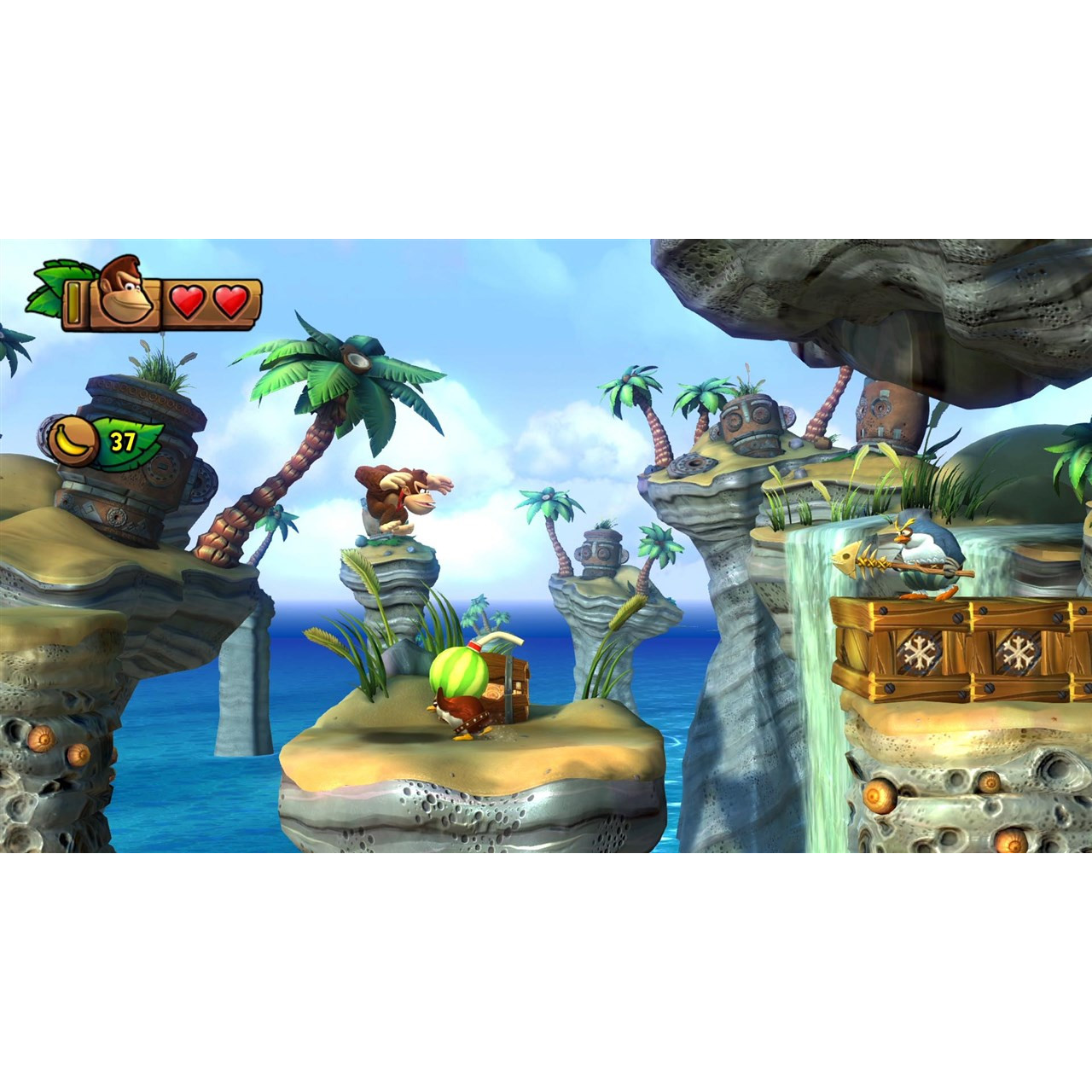 A Donkey Kong game scene with platforms, water, and characters. Donkey Kong is jumping.