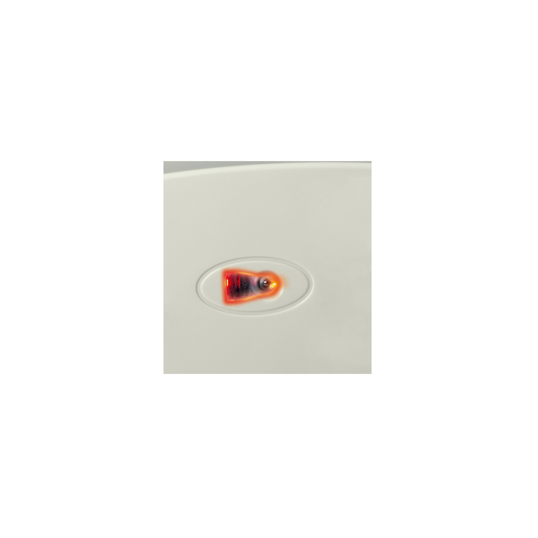 Close-up of a red light within an oval shape, on a white surface.
