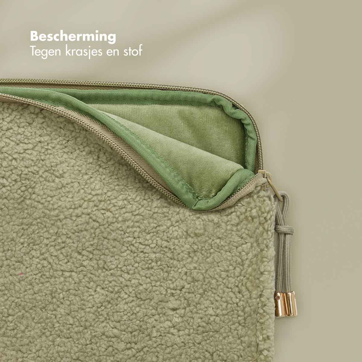 A green laptop sleeve with a zipper and a drawstring. Text says 'protection'.