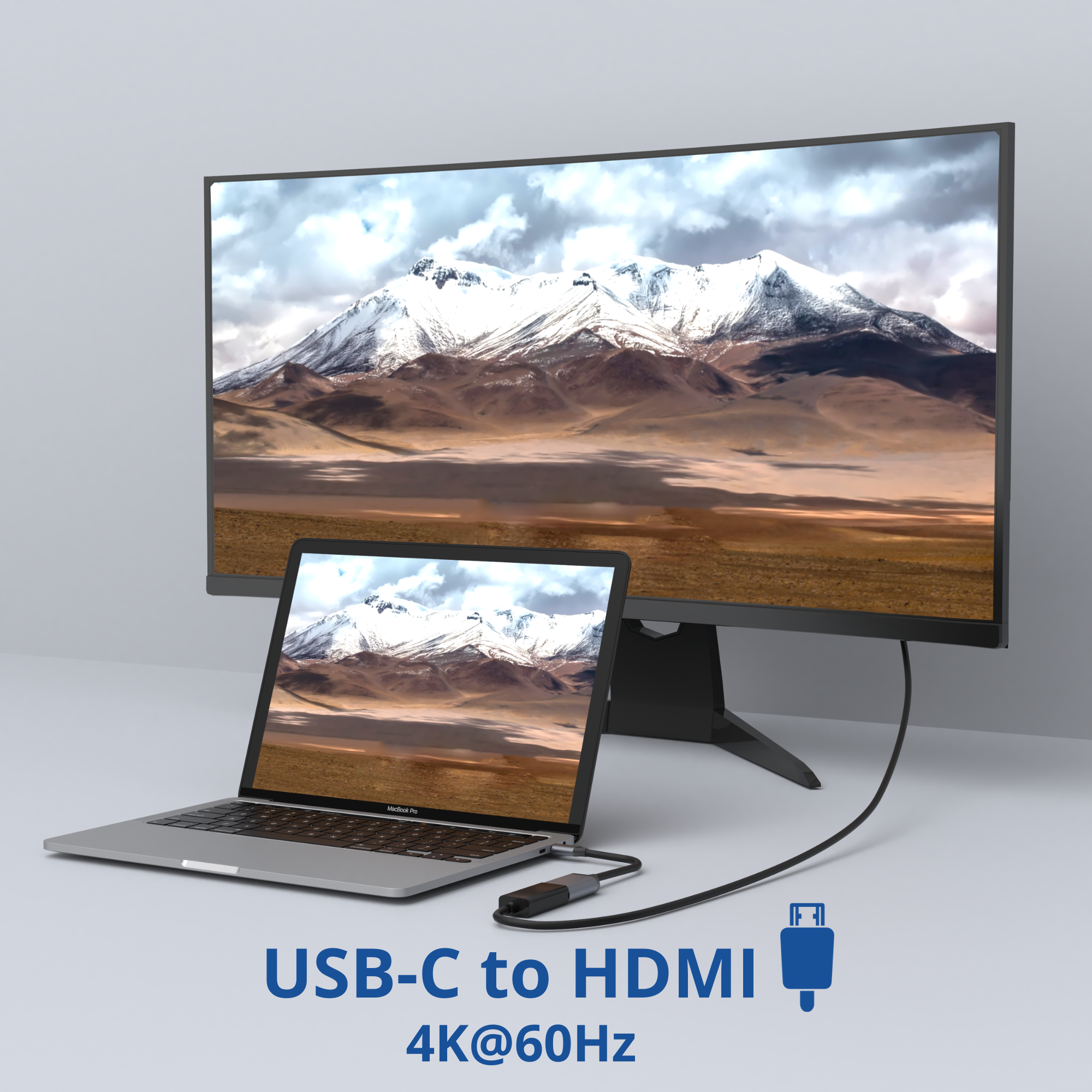 Ordinateur portable connecté à un moniteur via USB-C. Le moniteur montre une montagne.