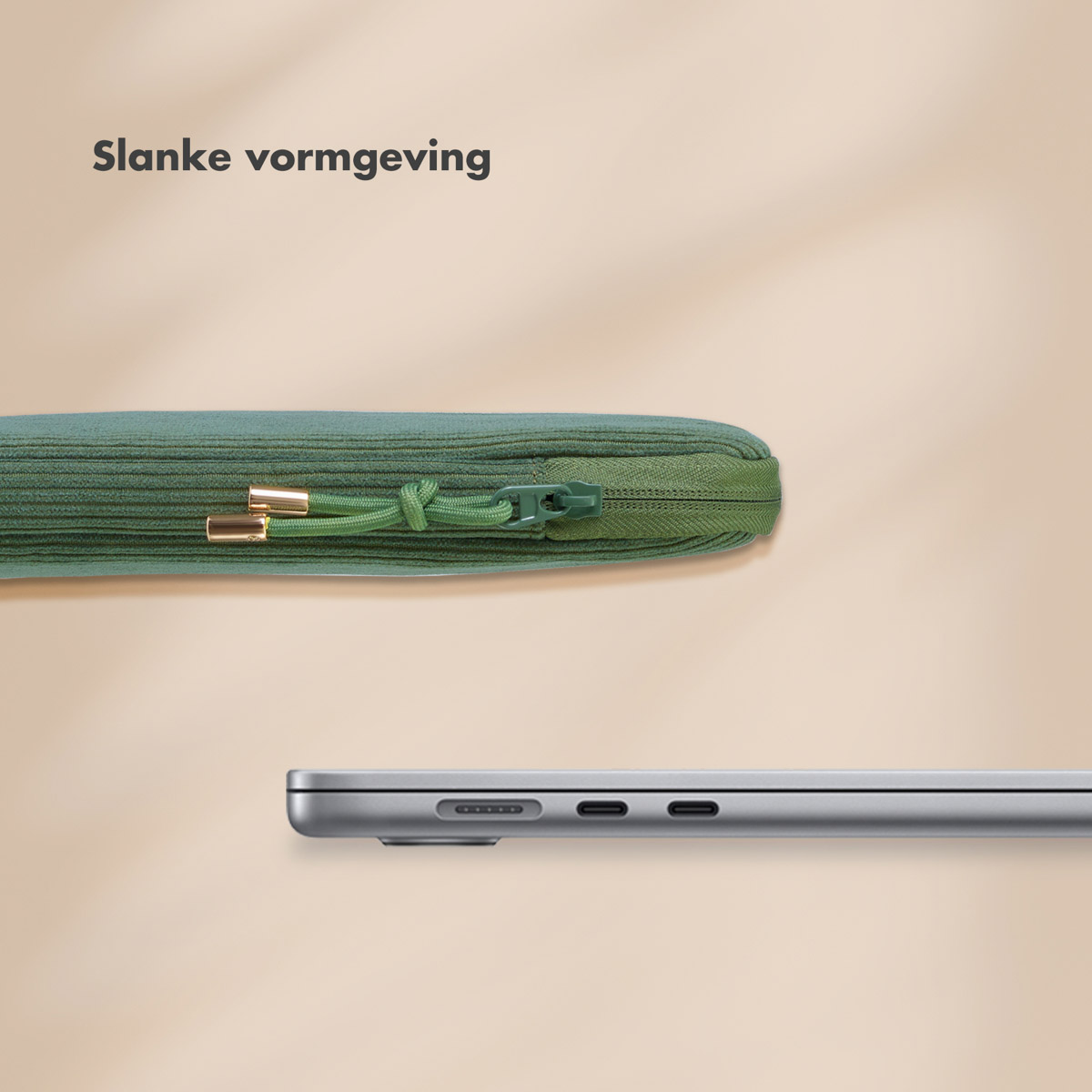 Laptop and green sleeve. The sleeve is closed, with a zipper and gold details.