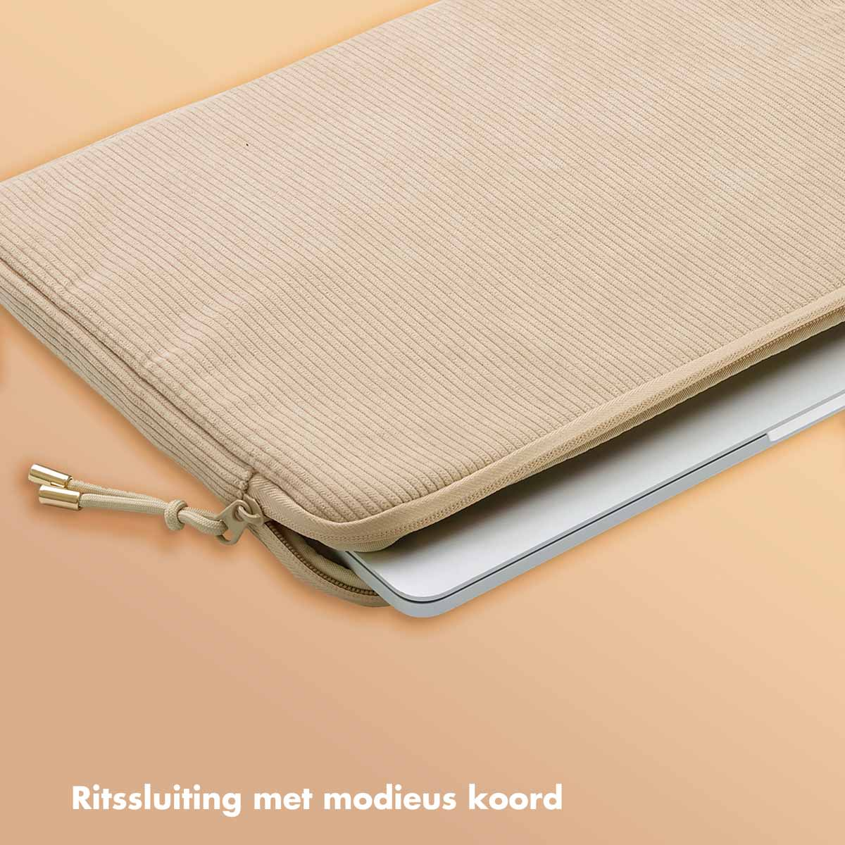 A laptop sits inside a beige, corduroy-textured sleeve with a zipper and a cord.