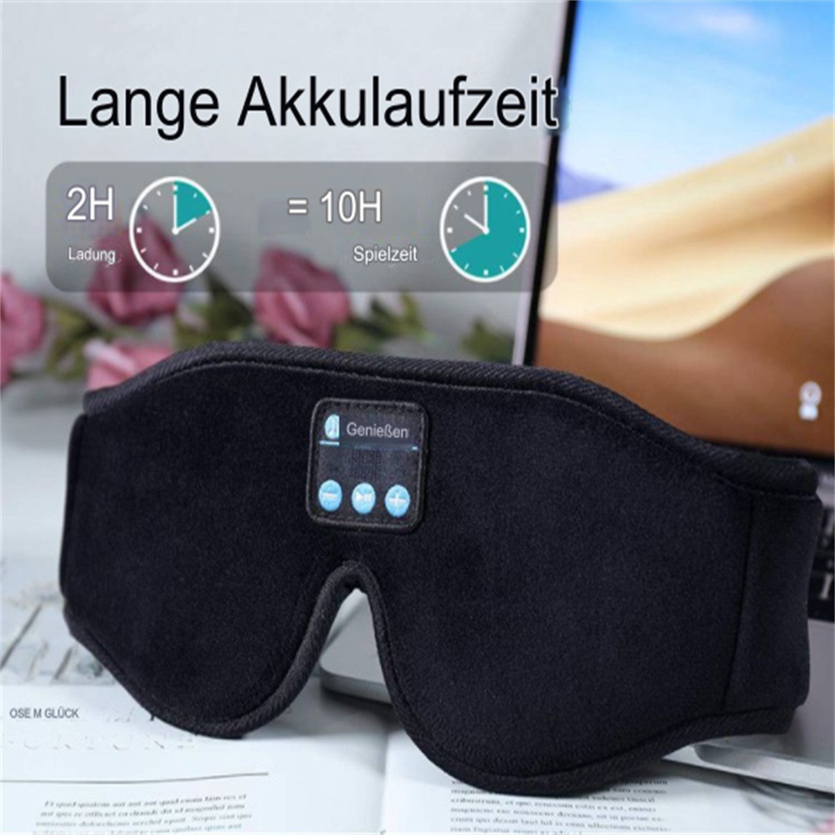 Schwarze Schlafmaske mit dem Text 'Lange Akkulaufzeit' und zwei Uhren, die Zeit anzeigen.