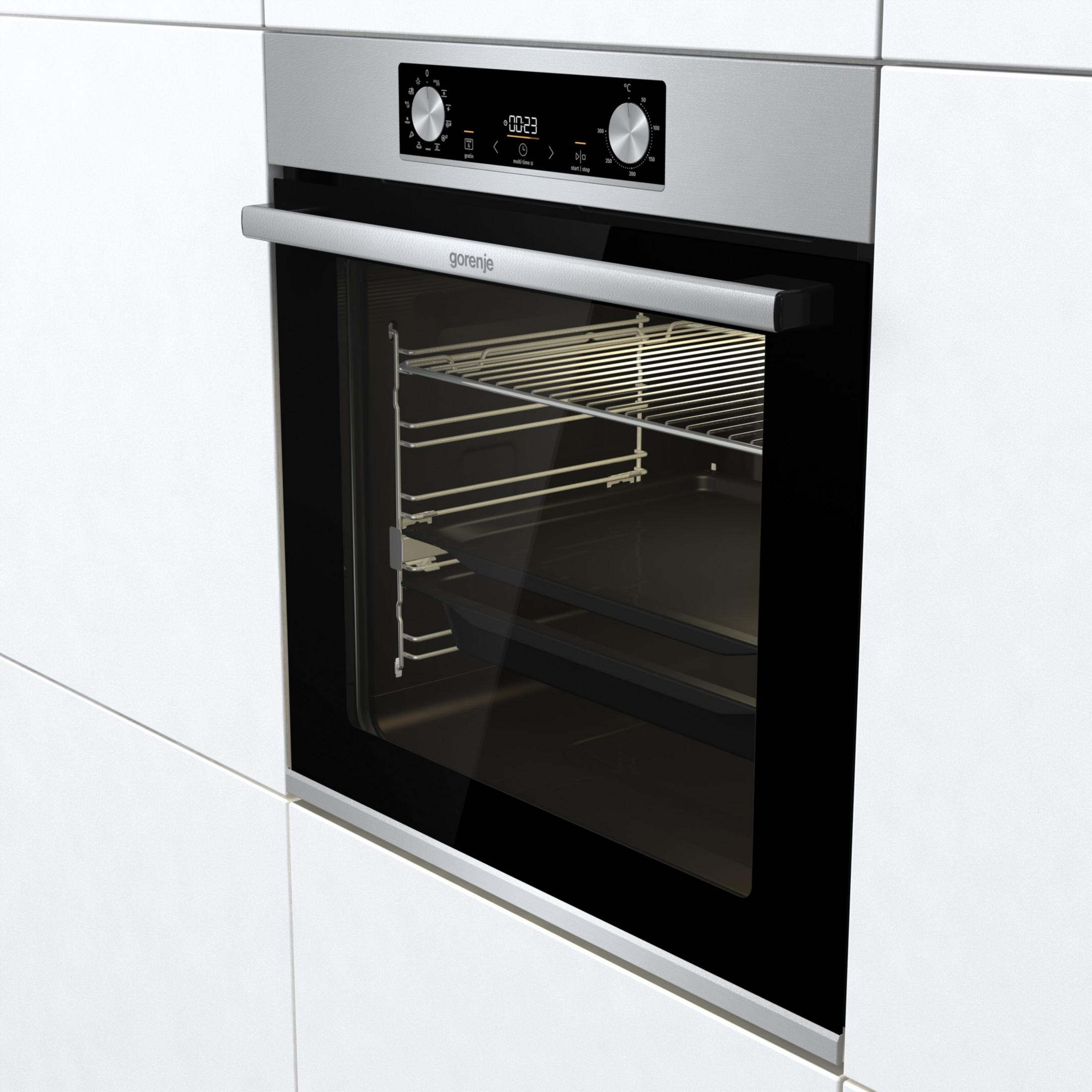 Silberner Backofen in weißem Schrank, mit Glastür und Bedienelementen.