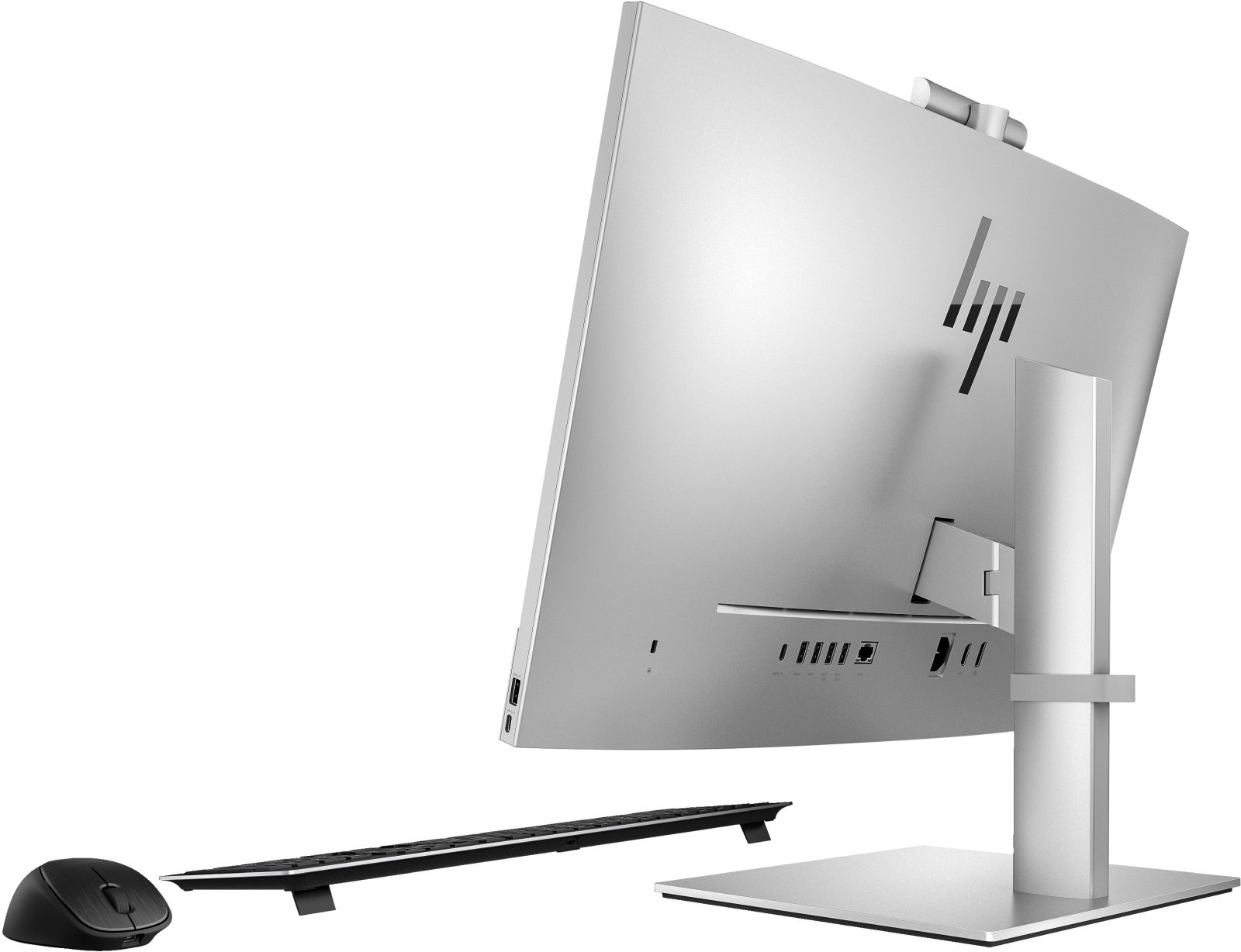Ein silberner und schwarzer Computermonitor, Maus und Tastatur auf weißem Hintergrund.