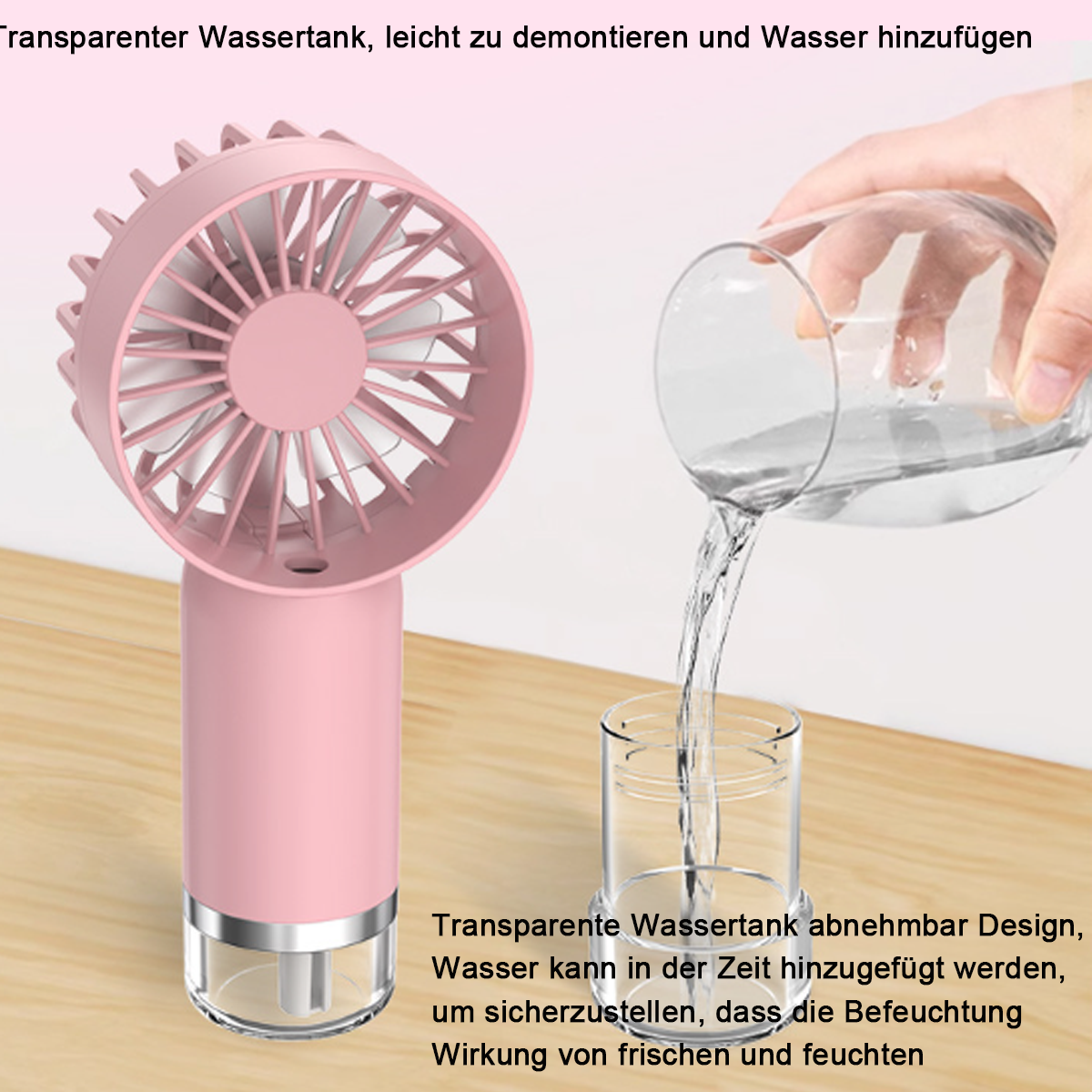 Rosa tragbarer Ventilator mit Wasser, das in einen Behälter gegossen wird.