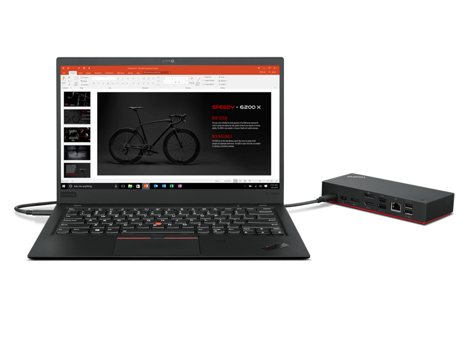 Laptop, der mit einer schwarzen Dockingstation verbunden ist. Laptop-Bildschirm zeigt Präsentation über ein Fahrrad.