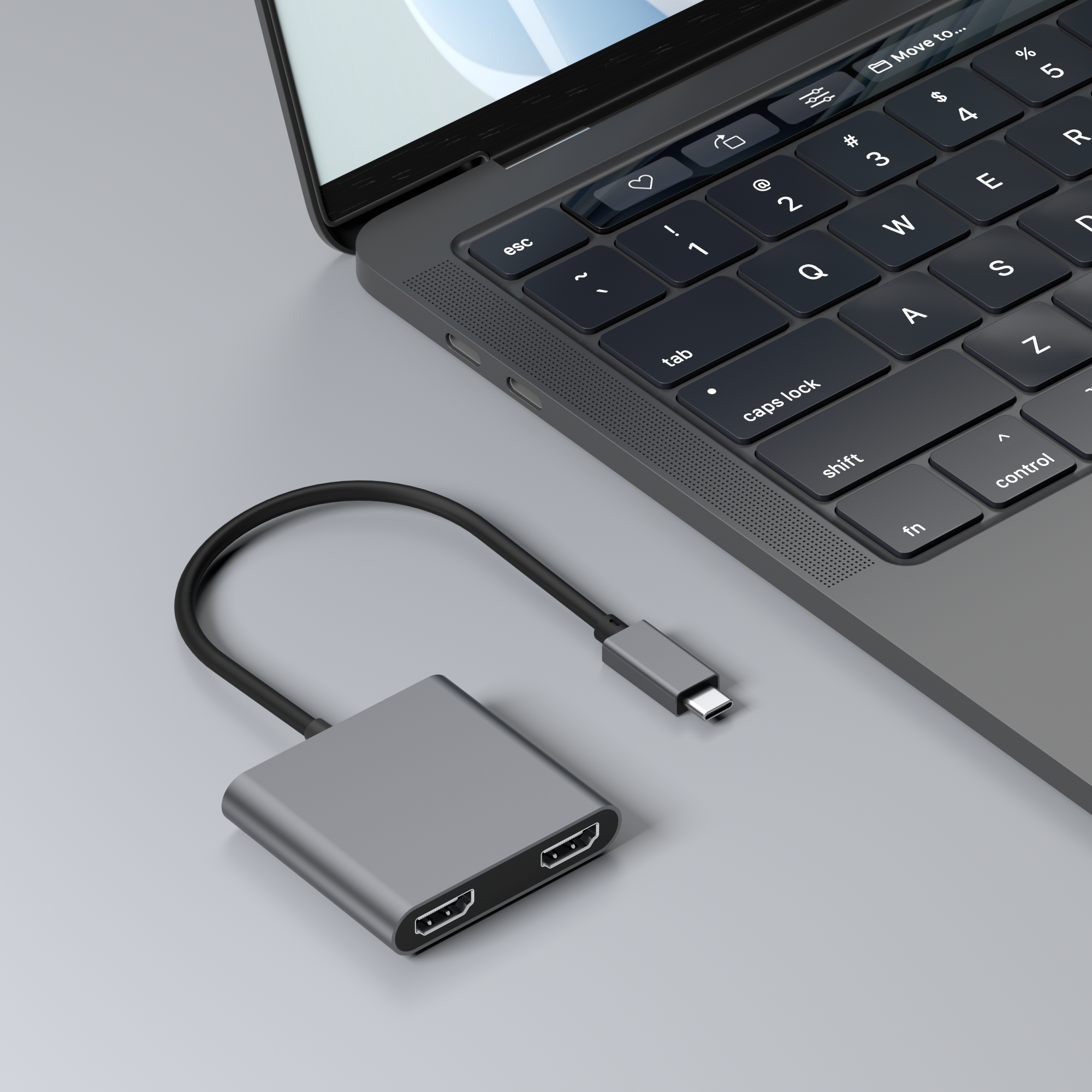 Ordinateur portable avec un adaptateur gris connecté au port USB-C.