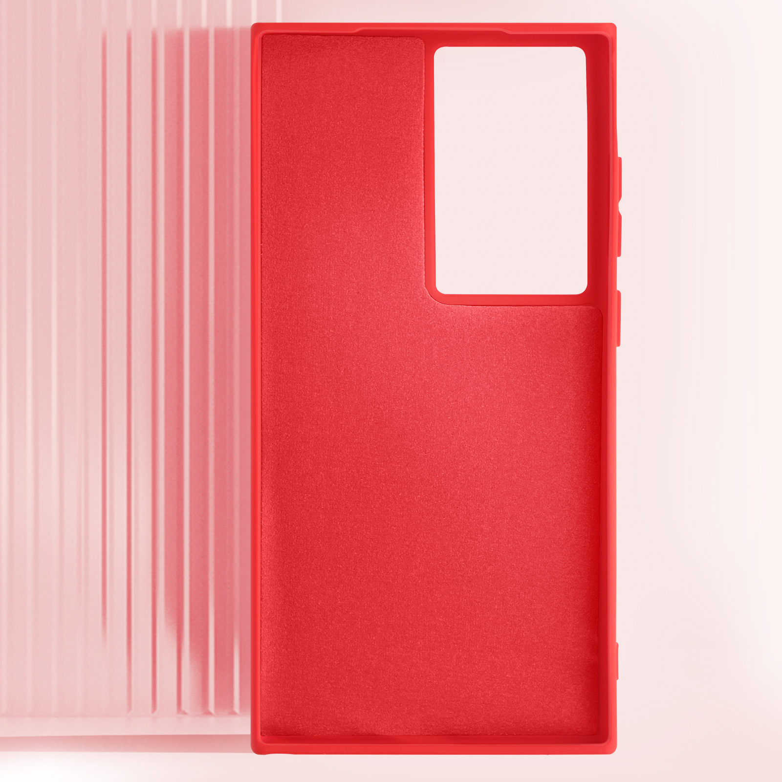 Una custodia per telefono rossa con un ritaglio per la fotocamera e un'area bianca per il telefono. Sfondo rosa.