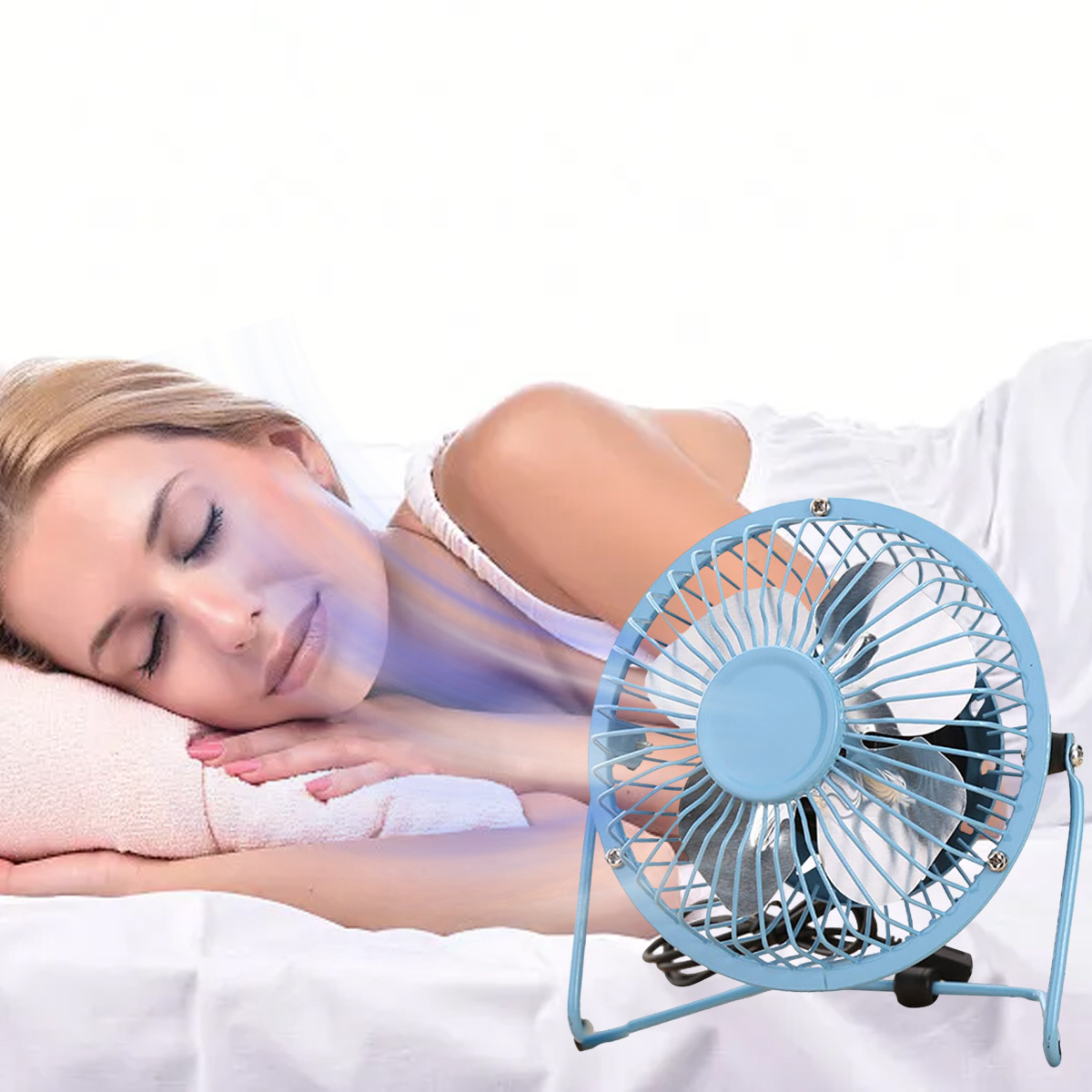 Ein blauer Ventilator, der Luft auf eine Frau bläst, die auf einem Bett liegt. Der Ventilator steht auf einem weißen Laken.