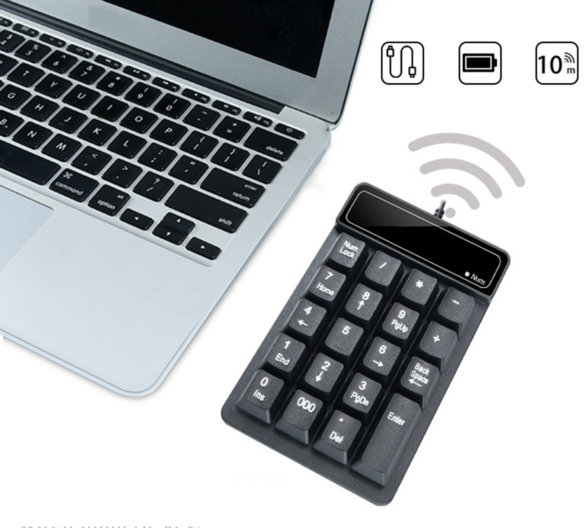 Ein Laptop und ein schwarzes numerisches Tastenfeld. Das Tastenfeld hat Tasten und ein Kabel.