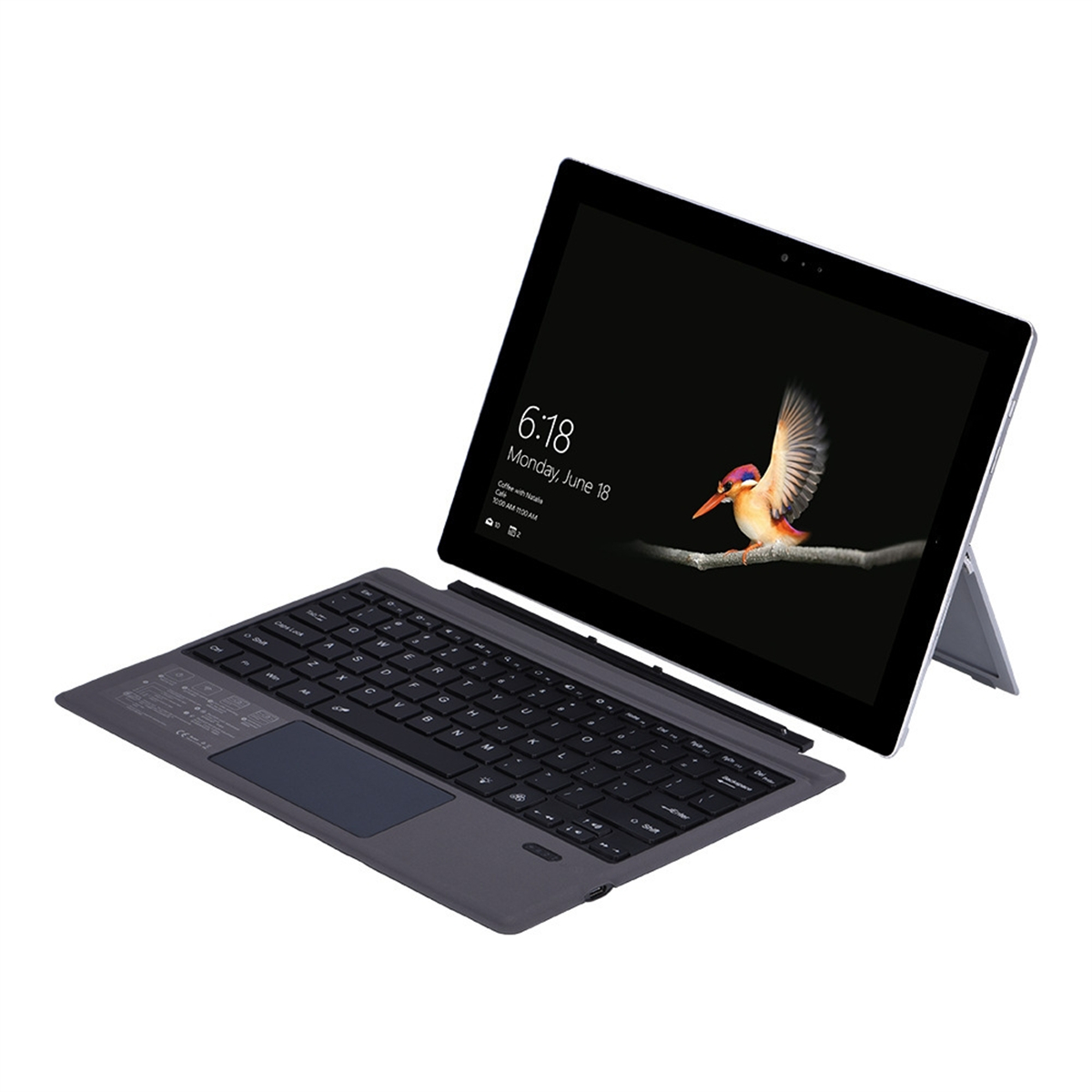 Tablet mit Tastatur, Bildschirm zeigt Zeit und Vogel. Tastatur ist schwarz.