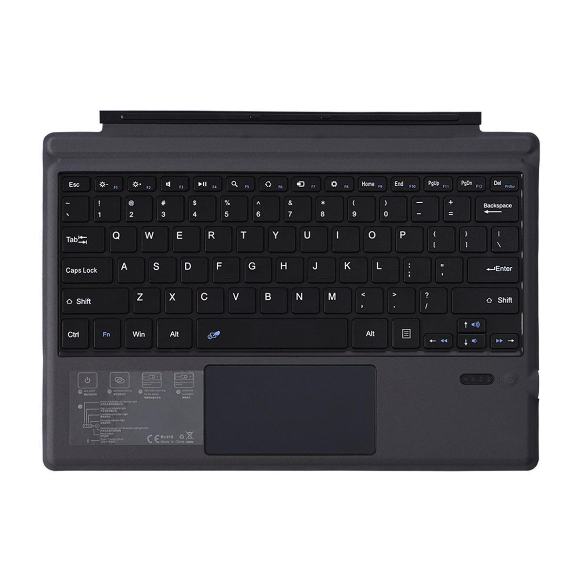 Eine schwarze Tastatur mit Touchpad und verschiedenen Tasten. Sie liegt auf einer weißen Oberfläche.