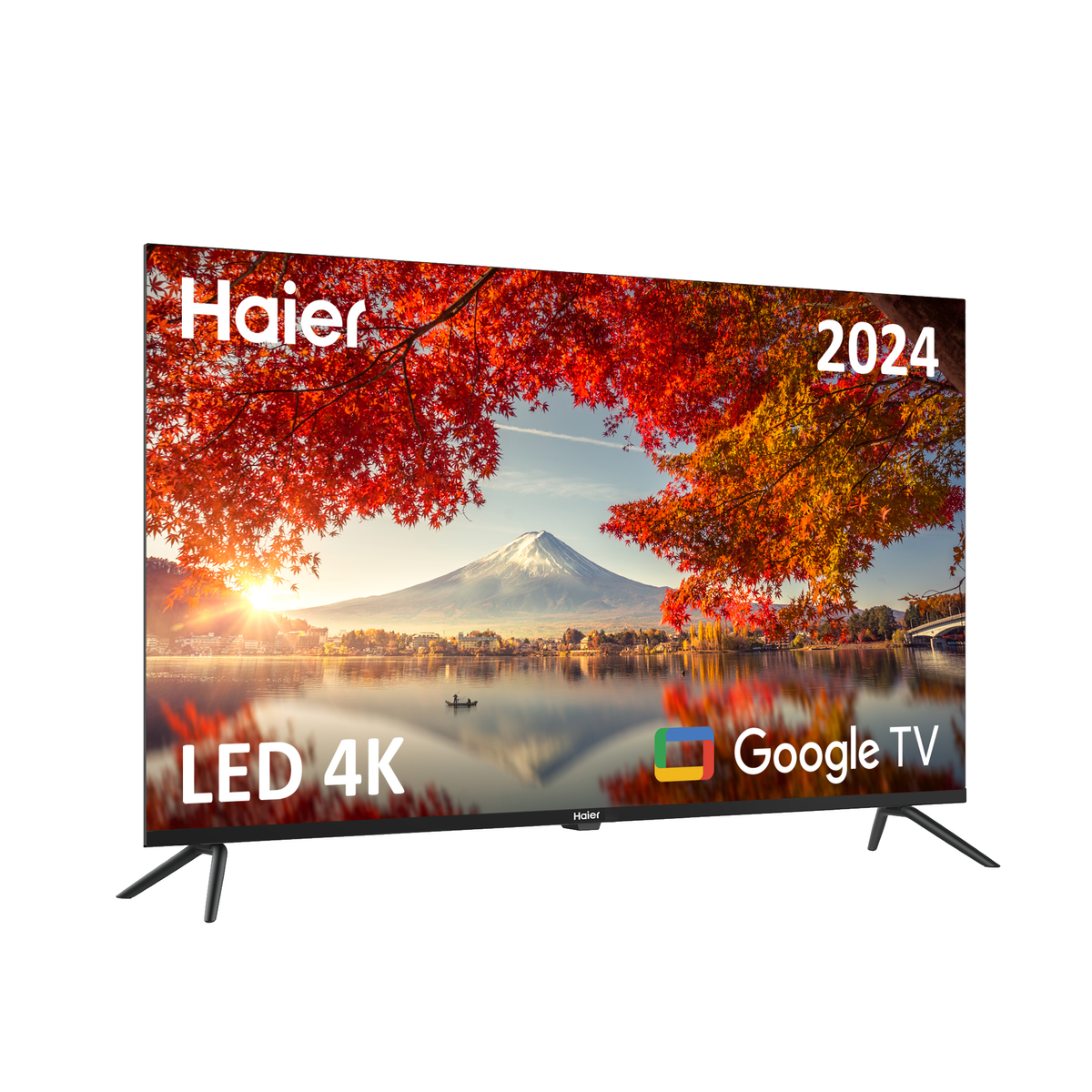 Un televisor Haier que muestra una escena de otoño con hojas rojas y una montaña, con el texto 2024.