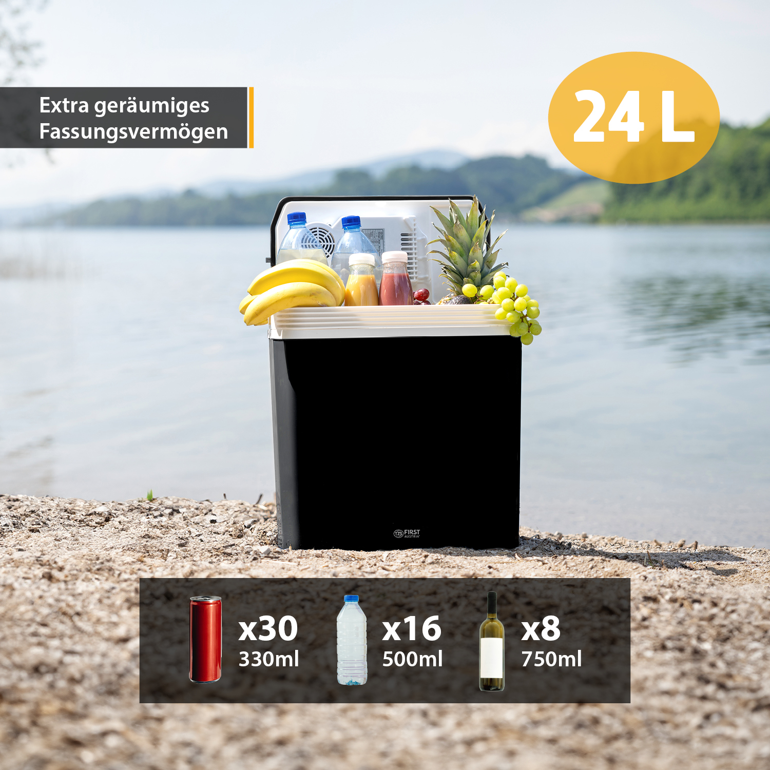 Schwarze Kühlbox mit Früchten und Getränken. 24L-Aufkleber oben. Draußen.