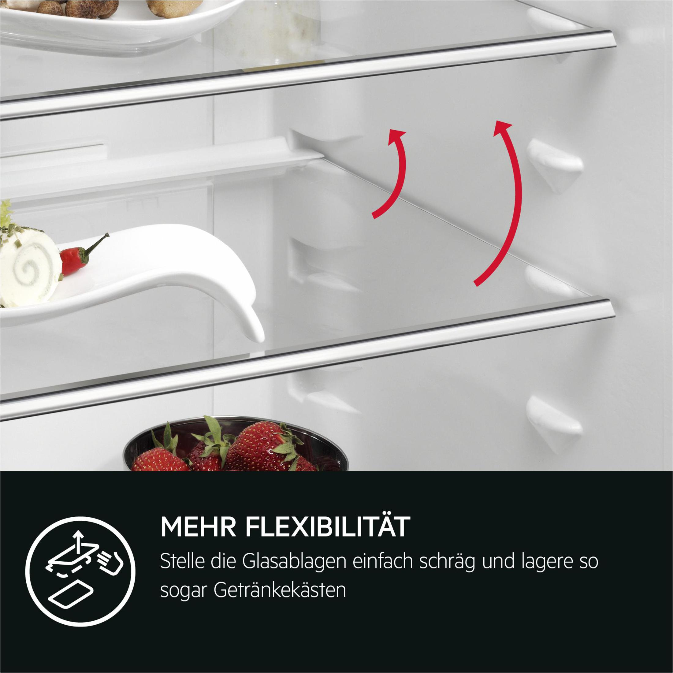 Open refrigerator with strawberries and a white dish inside. Text: More Flexibility.