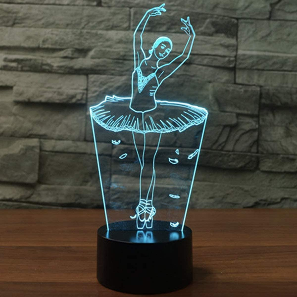 Eine 3D-LED-Ballerina-Lampe in einem dunklen Raum.