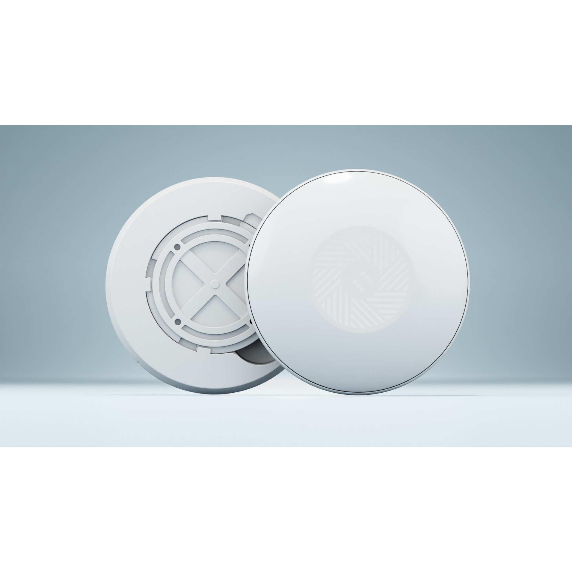 Dwa białe, okrągłe urządzenia. Jedno jest otwarte, pokazujące wewnętrzne komponenty. Drugie jest zamknięte.