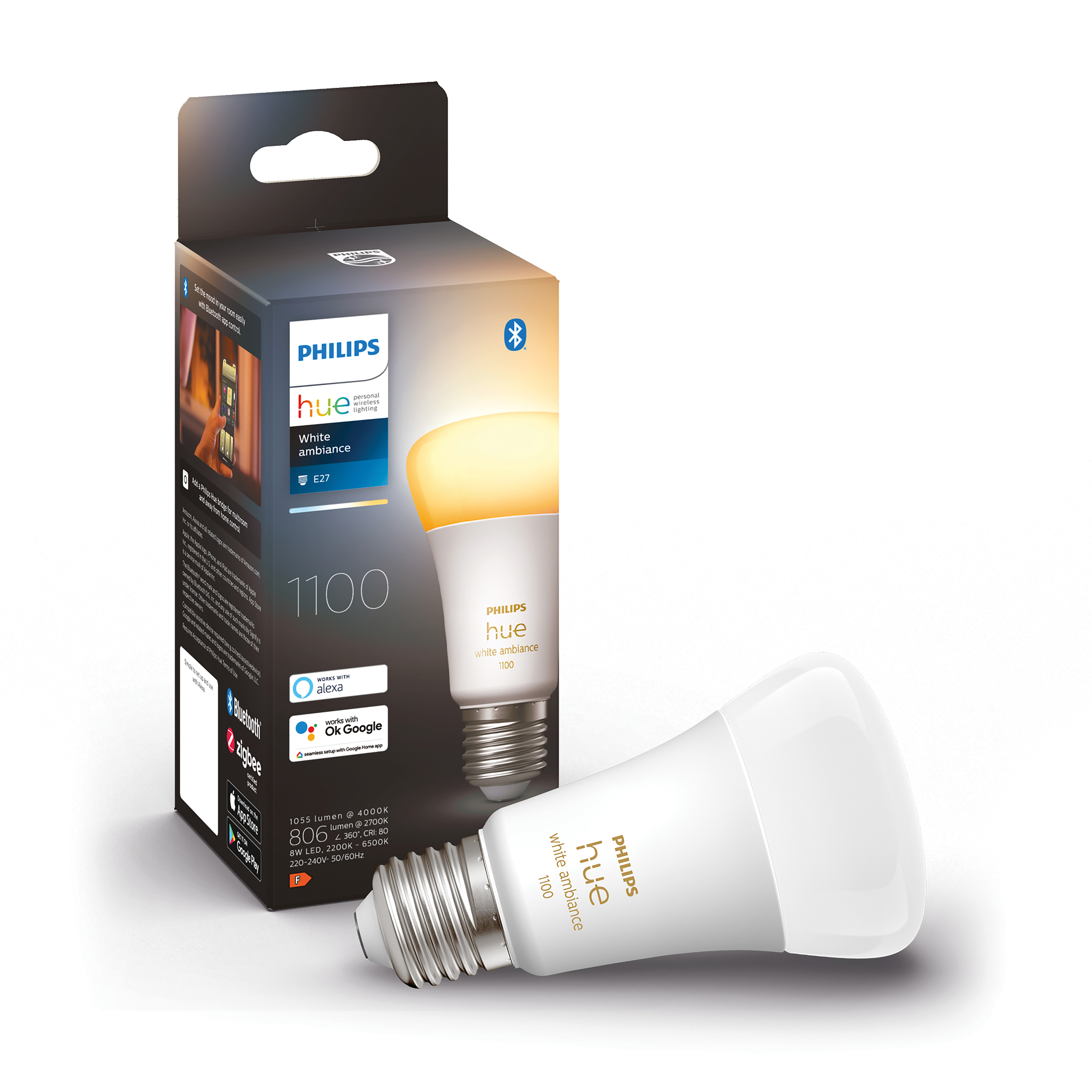 Philips Hue lamp, doos. Lamp is wit, geeft geel licht. Doos toont lamp en lichtfuncties.