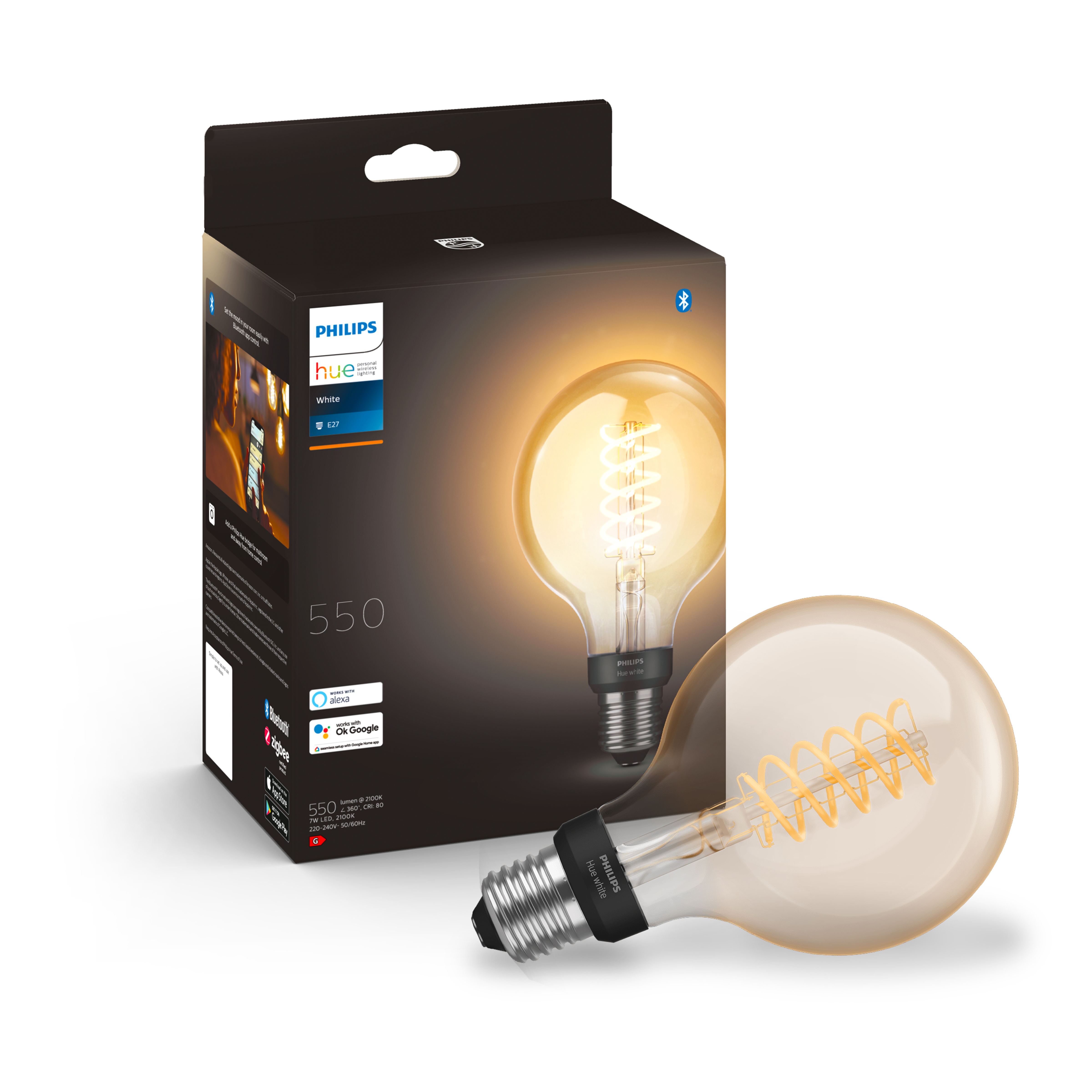 Een Philips Hue-lamp in de doos en een andere ernaast op een wit oppervlak.