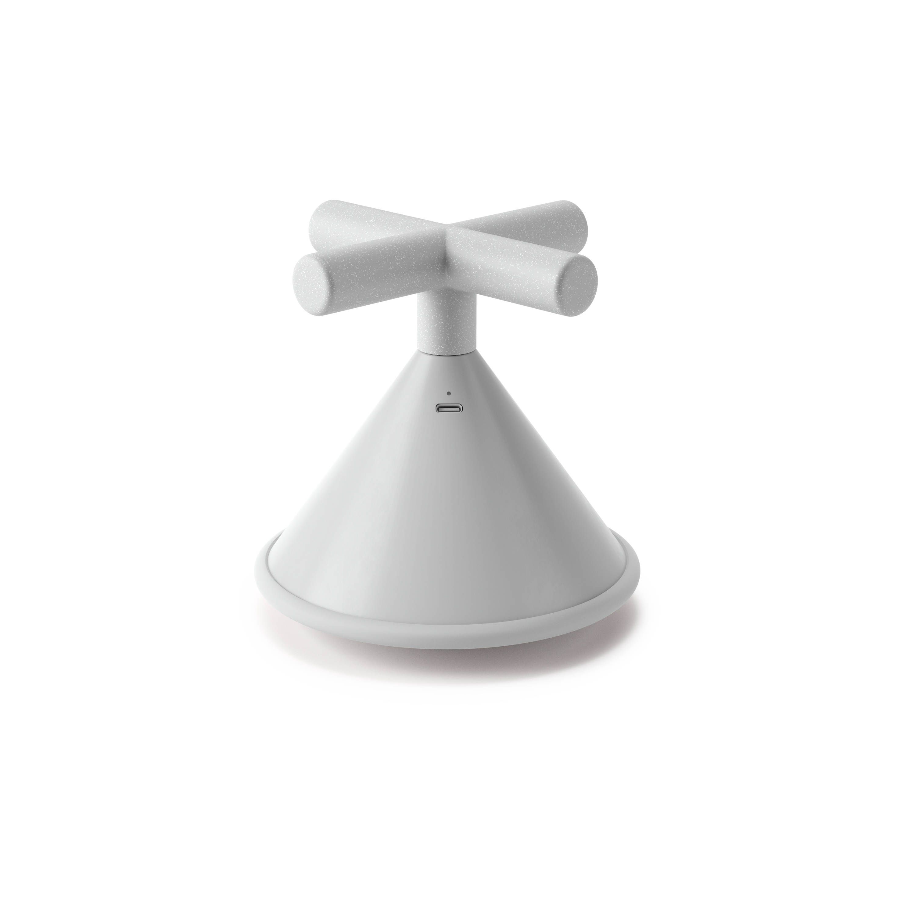 Un oggetto bianco a forma di cono con una parte superiore a forma di croce. Ha una porta USB ed è su una superficie bianca.