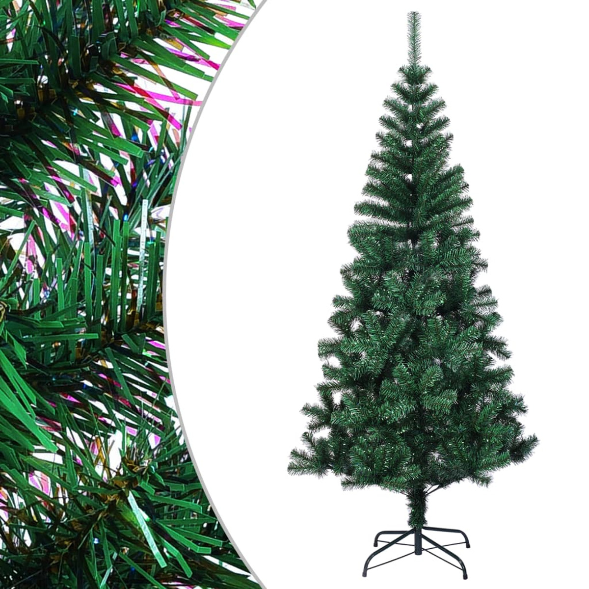 Ein grüner künstlicher Weihnachtsbaum steht auf einem schwarzen Metallsockel. Äste sind voll. Detail von grünen Nadeln links.