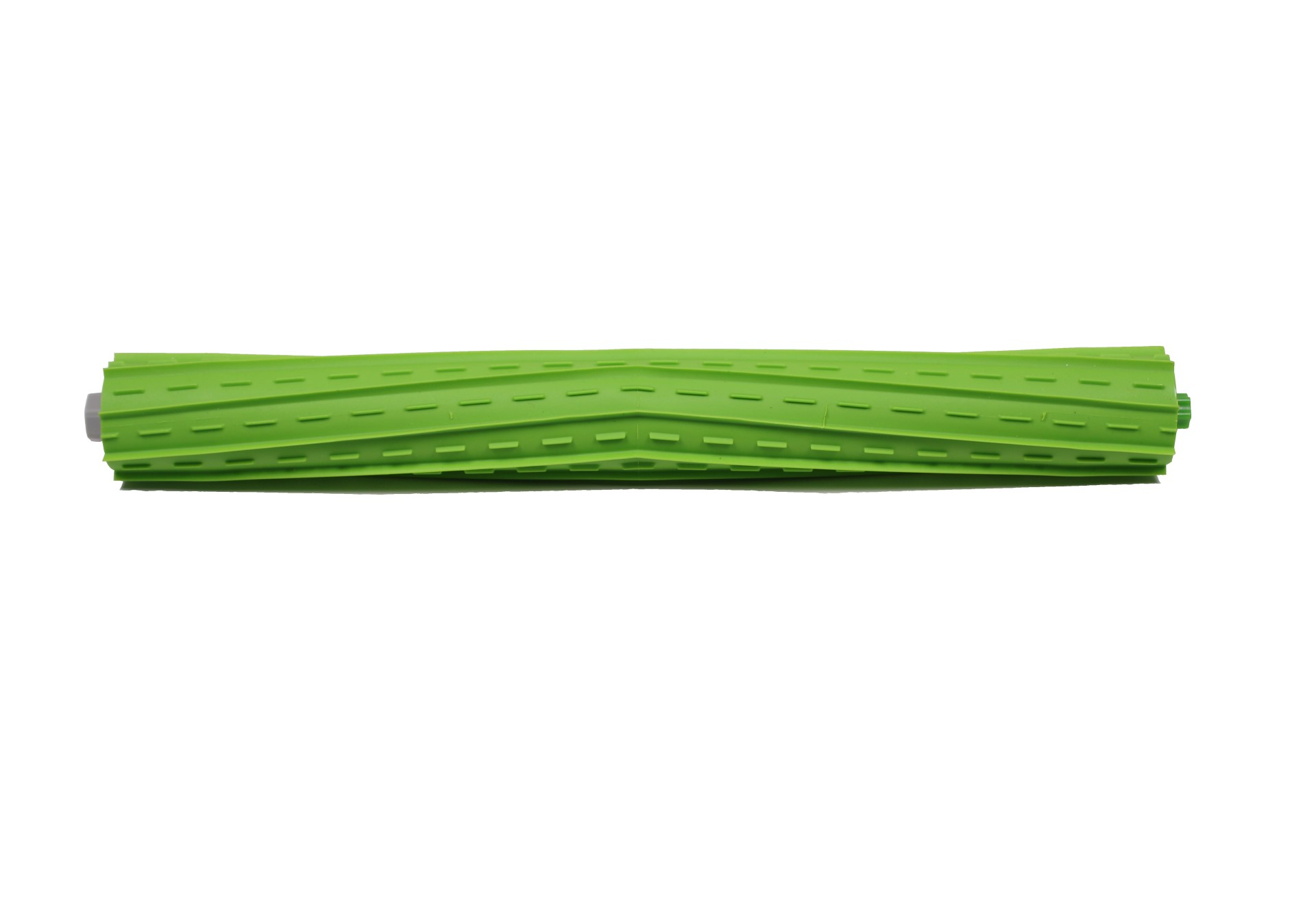 Grüne zylindrische Staubsaugerrolle mit Rillen und Mittelachse, von oben gesehen.