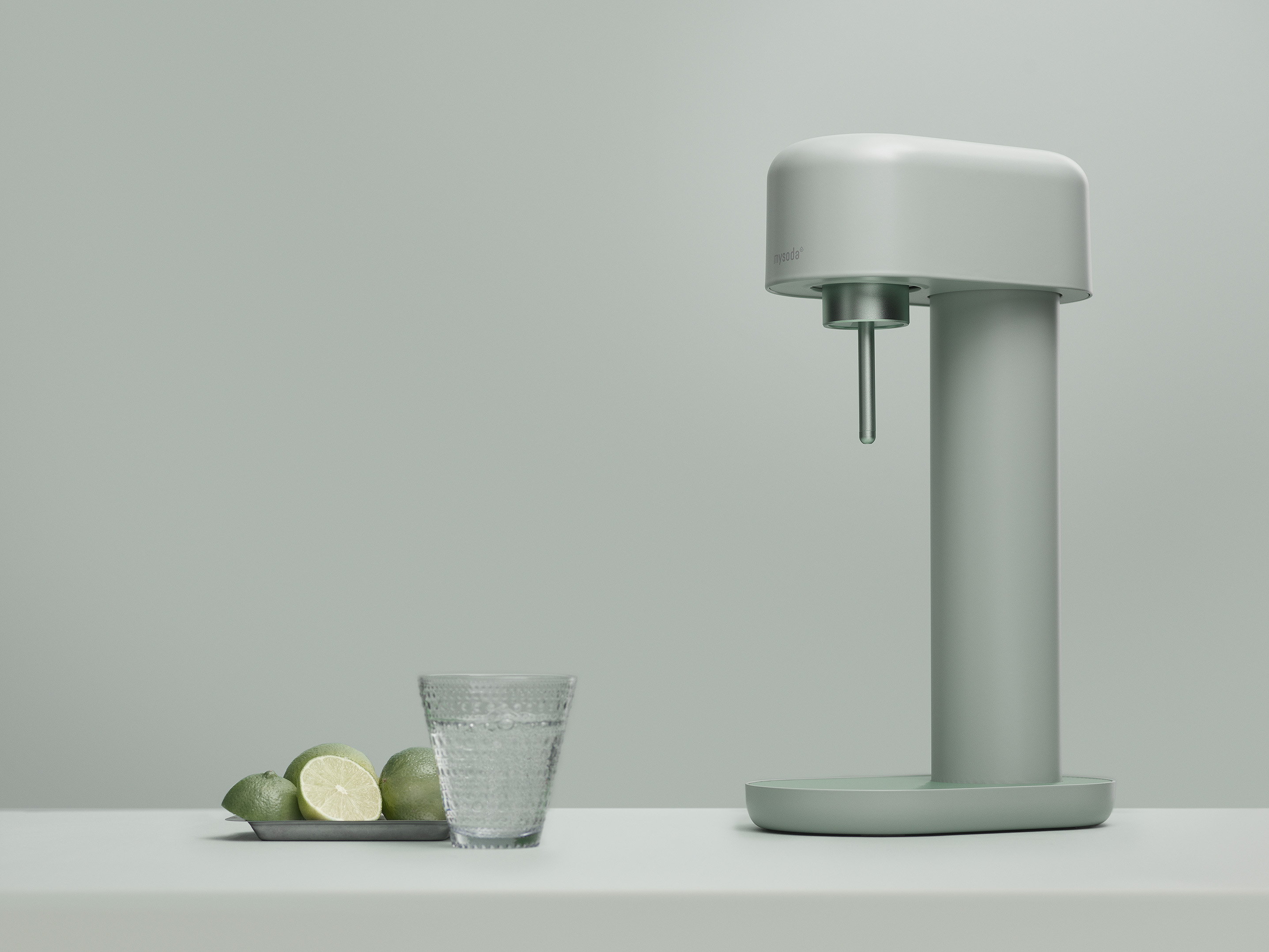 A water dispenser with a glass, lemons, and a gray background.