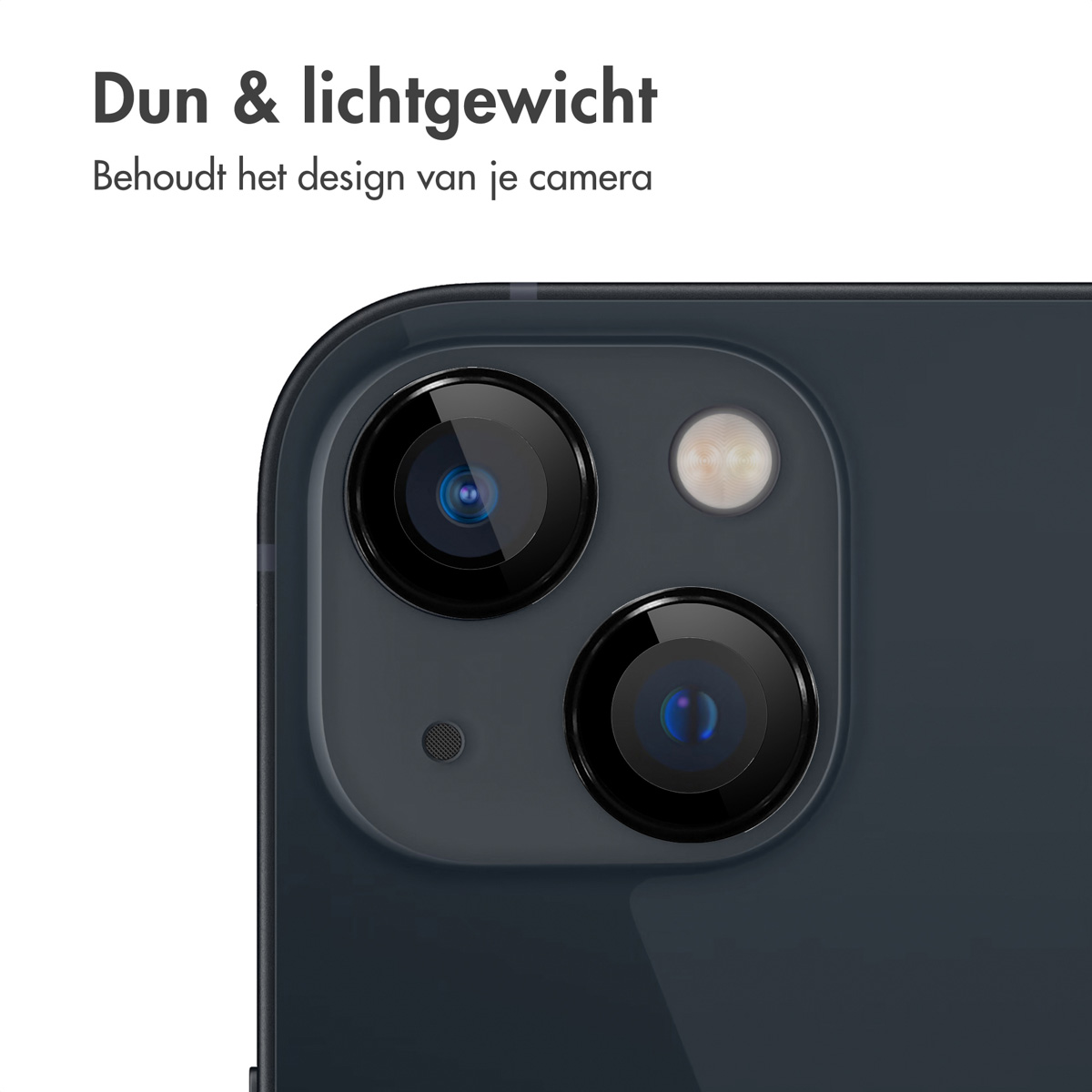 Close-up of phone camera. The phone is black. The background is black.