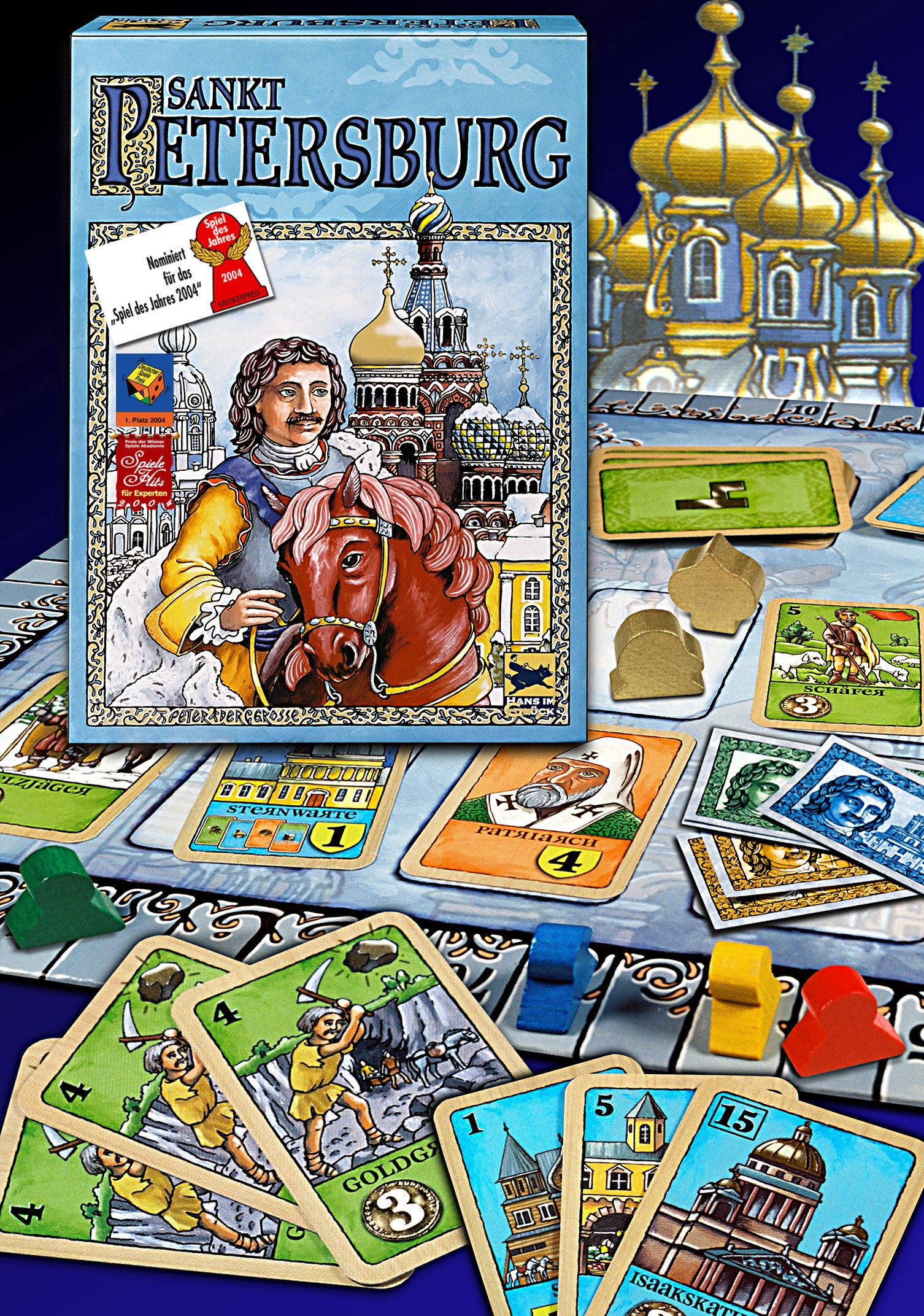 Das Brettspiel Sankt Petersburg mit Karten und Spielsteinen. Bunte Kunstwerke sind sichtbar.