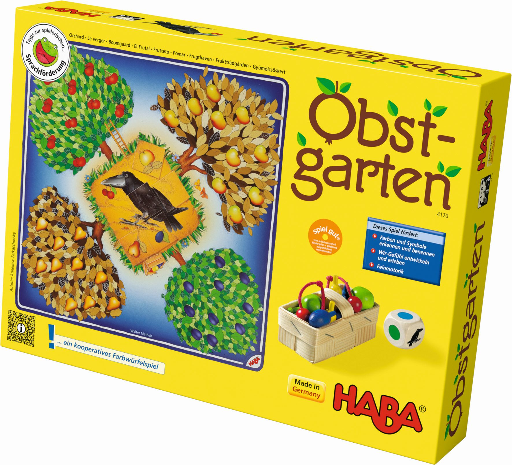 Gelbe Spielbox mit einem Baum und einem Korb mit Früchten. Ein Rabe ist im Baum.