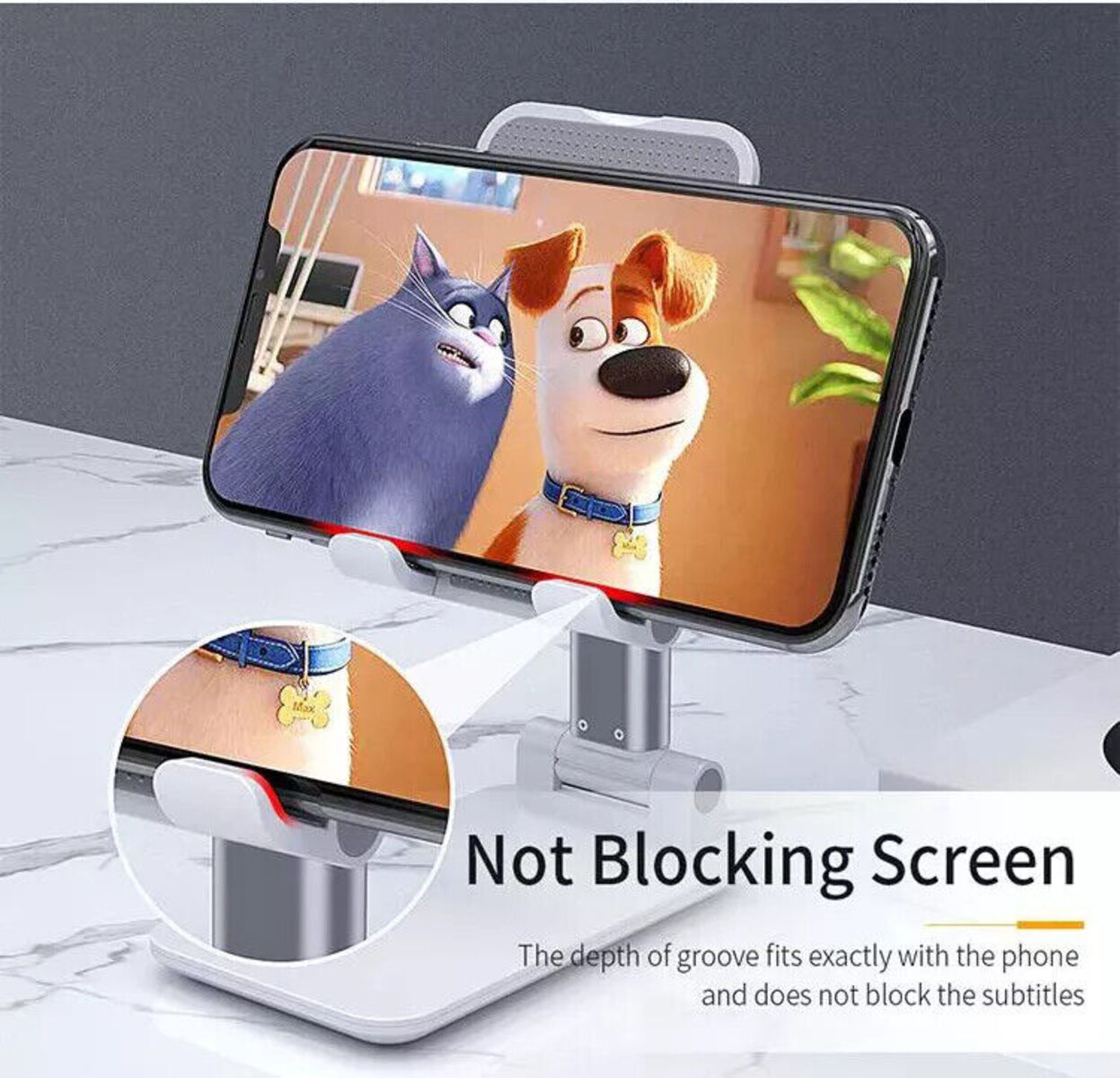 Ein Telefon auf einem Ständer zeigt eine Filmszene mit Zeichentrickfiguren.