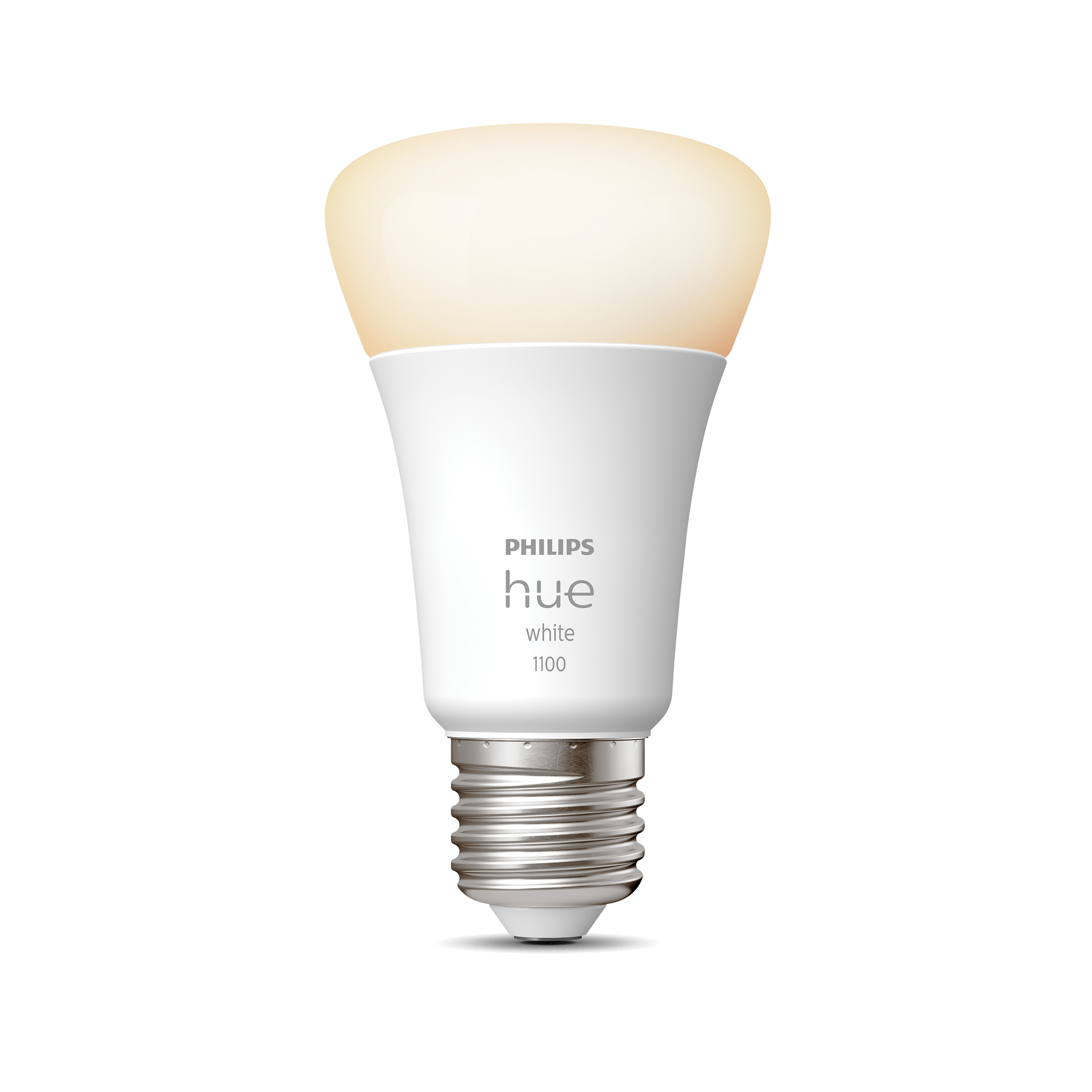 Biała żarówka Philips Hue. Żarówka świeci ciepłym białym światłem. Białe tło.